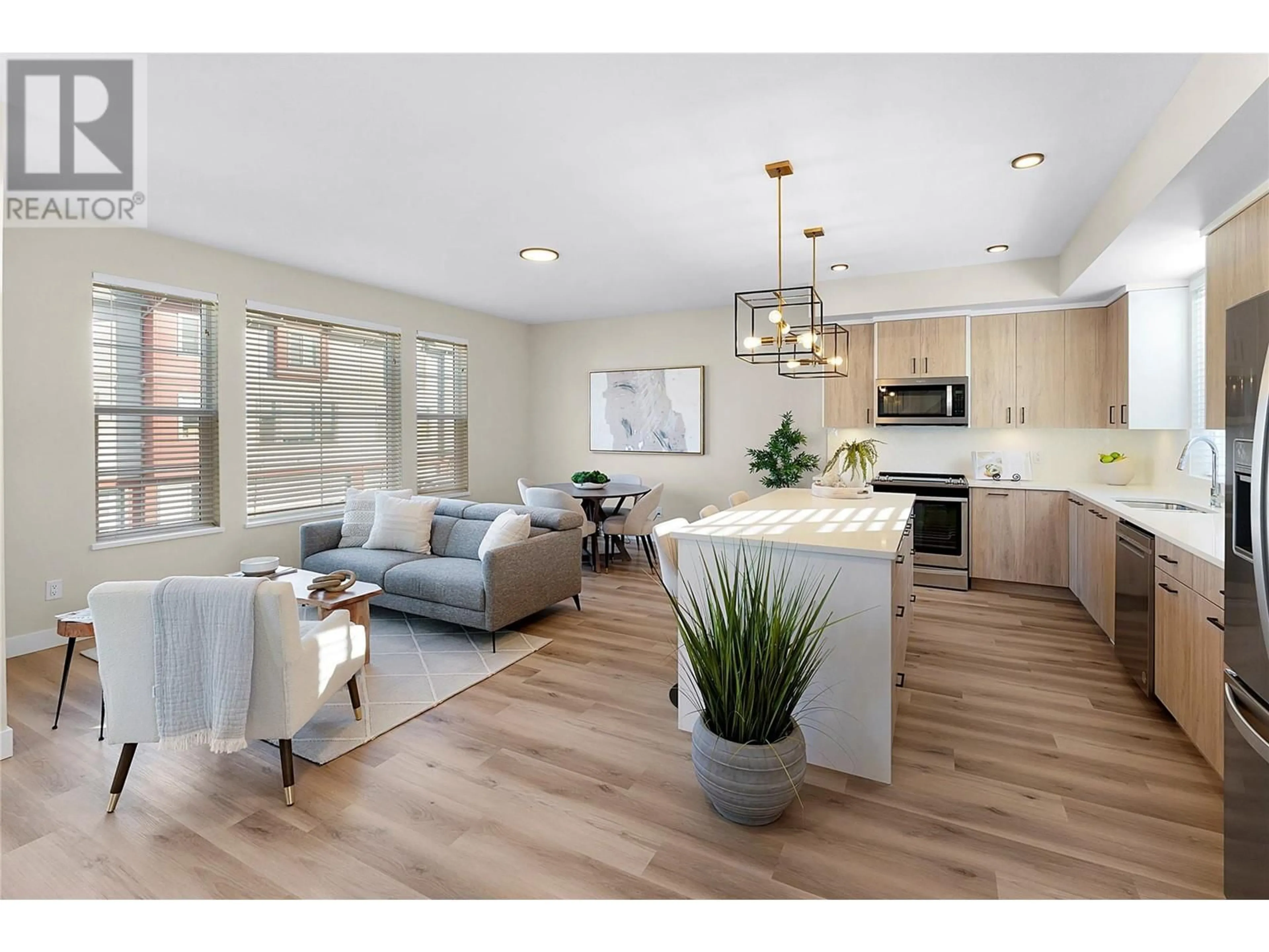Open concept kitchen, wood/laminate floor for 125 - 4025 GELLATLY ROAD SOUTH, West Kelowna British Columbia V4T0E6