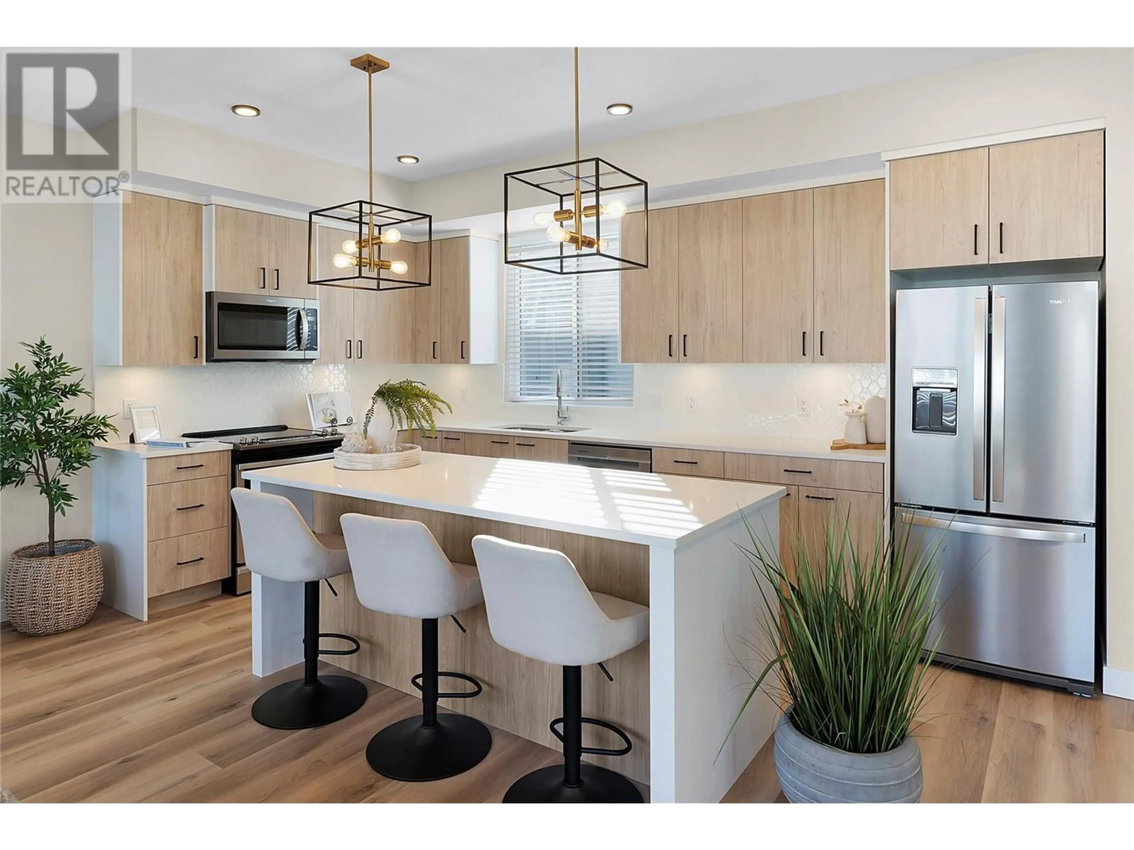 Open concept kitchen, wood/laminate floor for 125 - 4025 GELLATLY ROAD SOUTH, West Kelowna British Columbia V4T0E6