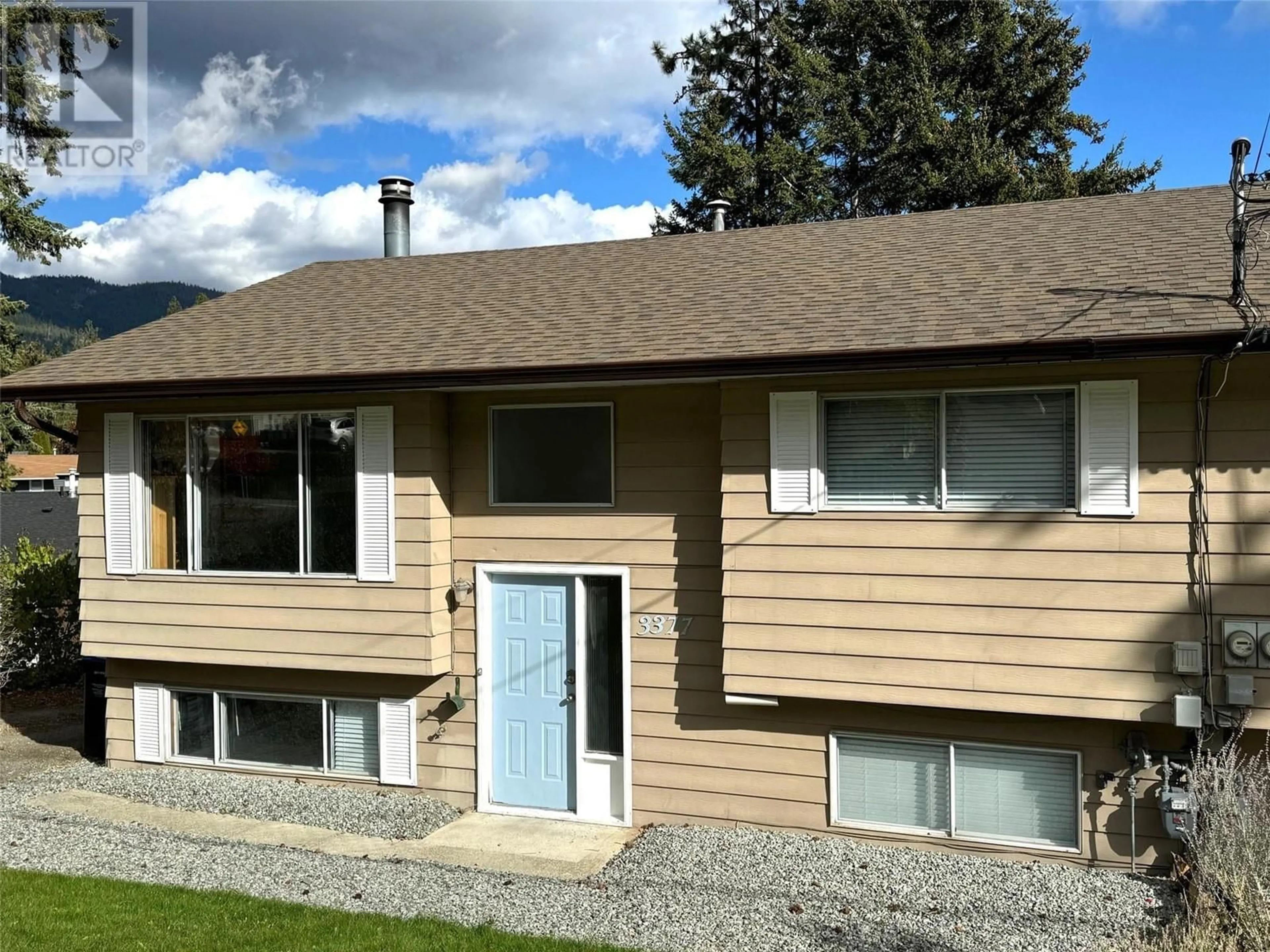 Home with vinyl exterior material, street for 3377 McIver Road, West Kelowna British Columbia V4T1H7