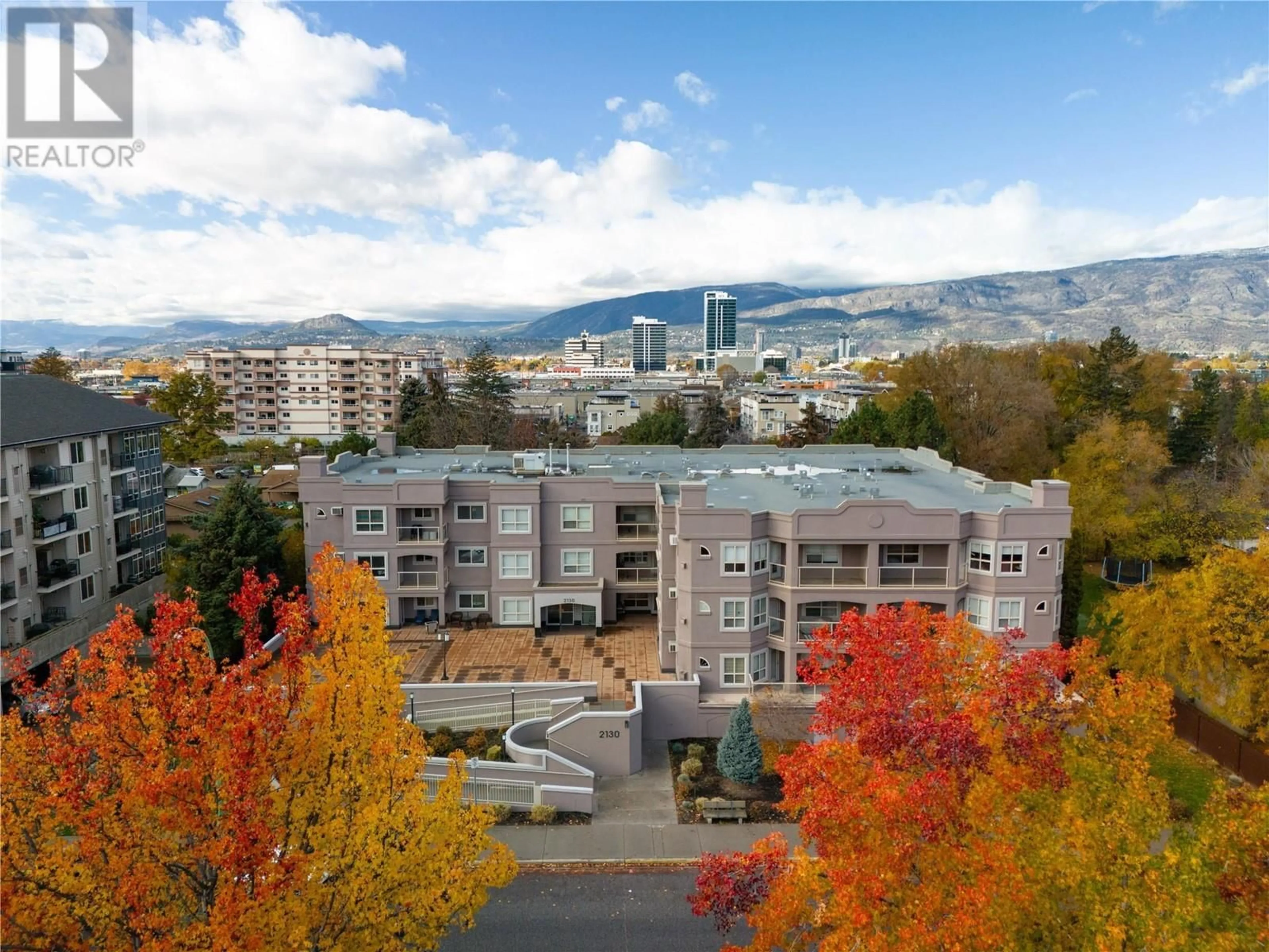 A pic from outside/outdoor area/front of a property/back of a property/a pic from drone, mountain view for 2130 Vasile Road Unit# 102, Kelowna British Columbia V1Y6H5