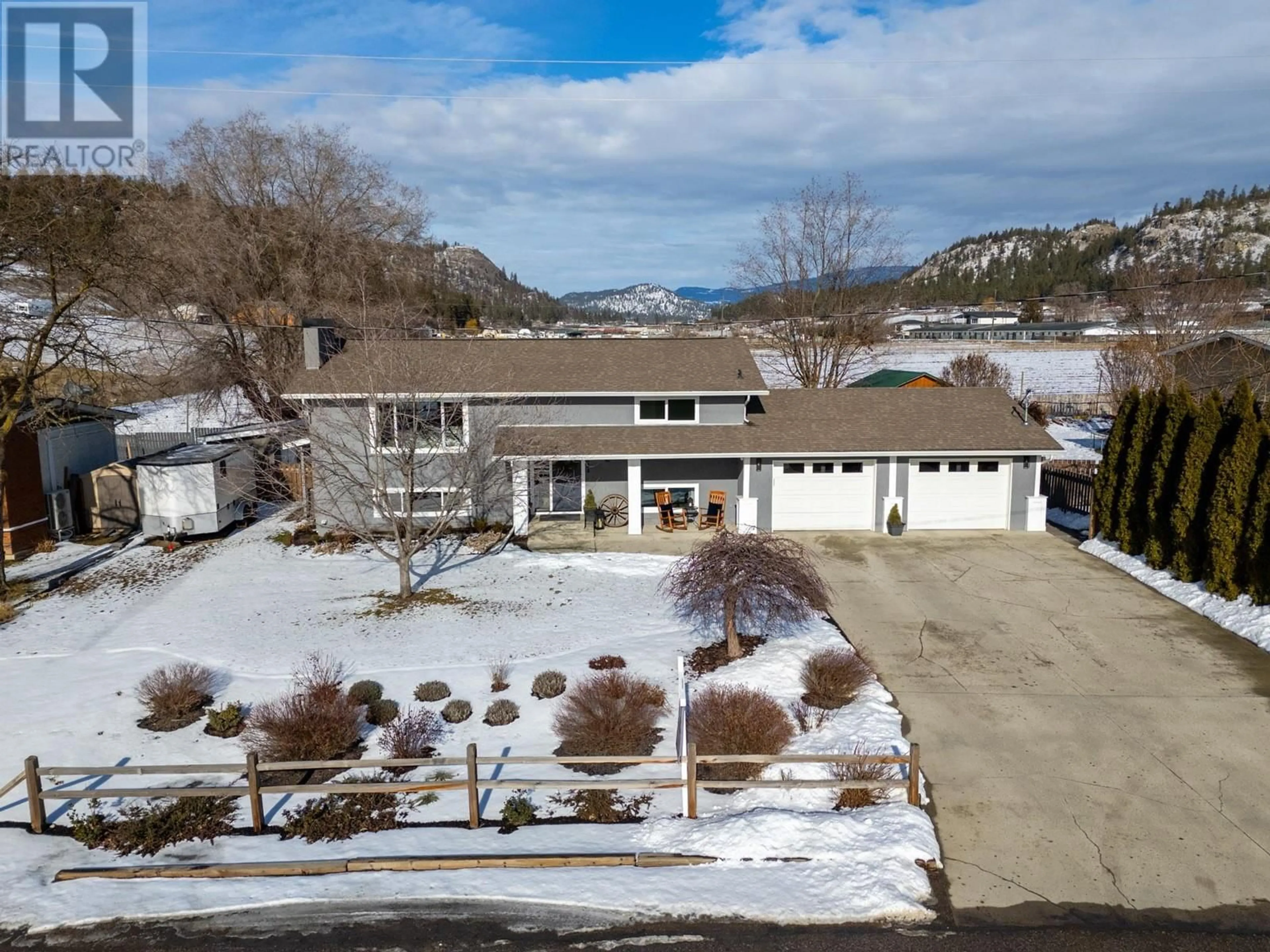 A pic from outside/outdoor area/front of a property/back of a property/a pic from drone, mountain view for 1824 Kerr Road, Kelowna British Columbia V1V1X2