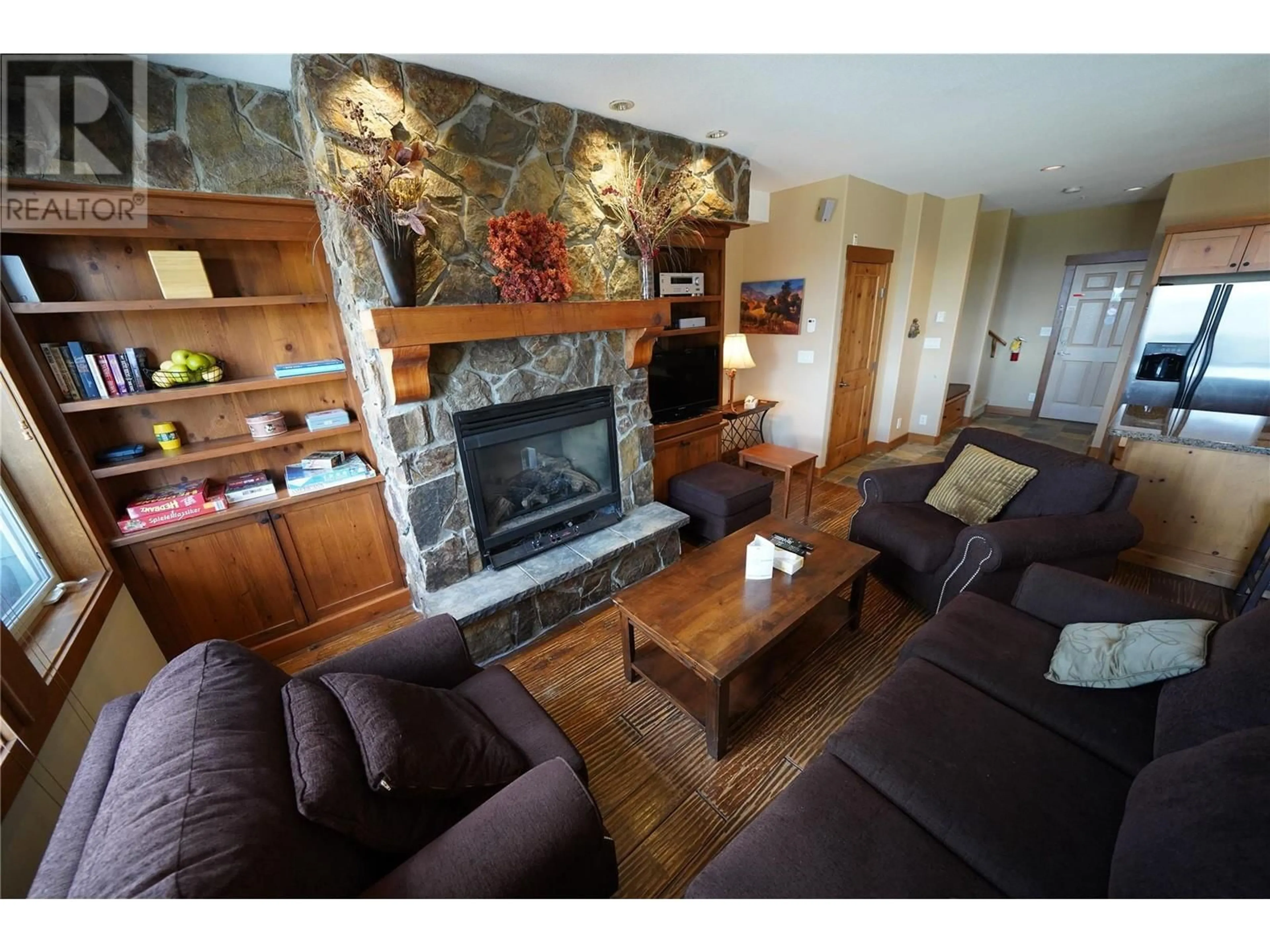Living room with furniture, wood/laminate floor for 3 - 255 RAVEN RIDGE ROAD, Big White British Columbia V0H1A0