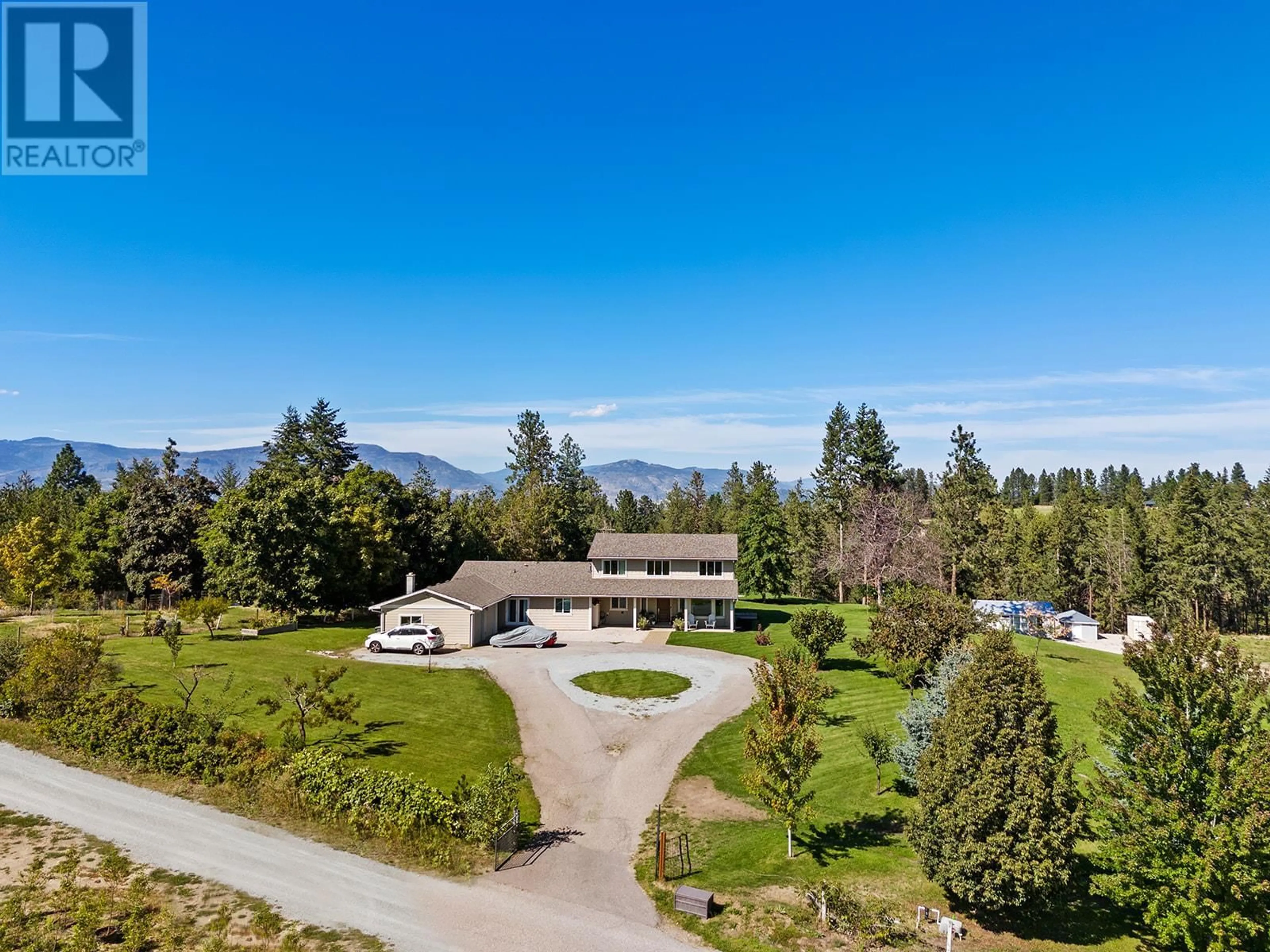 A pic from outside/outdoor area/front of a property/back of a property/a pic from drone, mountain view for 2378 Saucier Road, Kelowna British Columbia V1W4B8