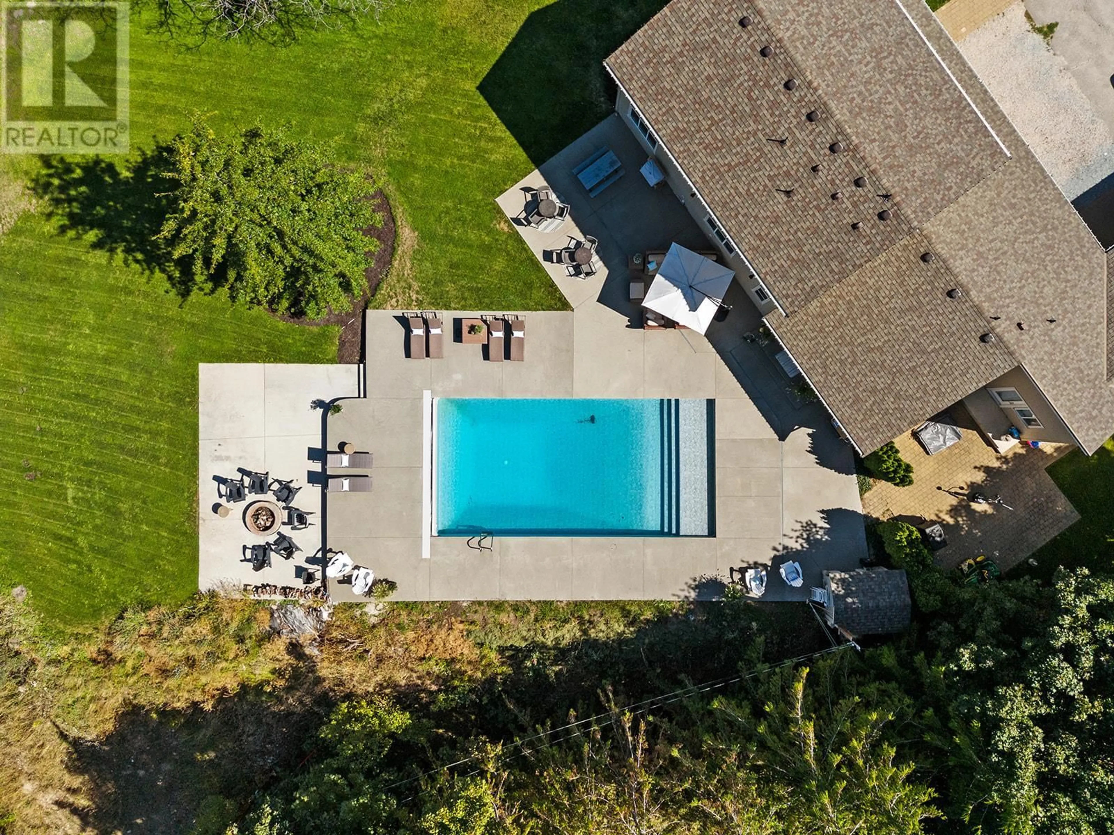 A pic from outside/outdoor area/front of a property/back of a property/a pic from drone, street for 2378 Saucier Road, Kelowna British Columbia V1W4B8