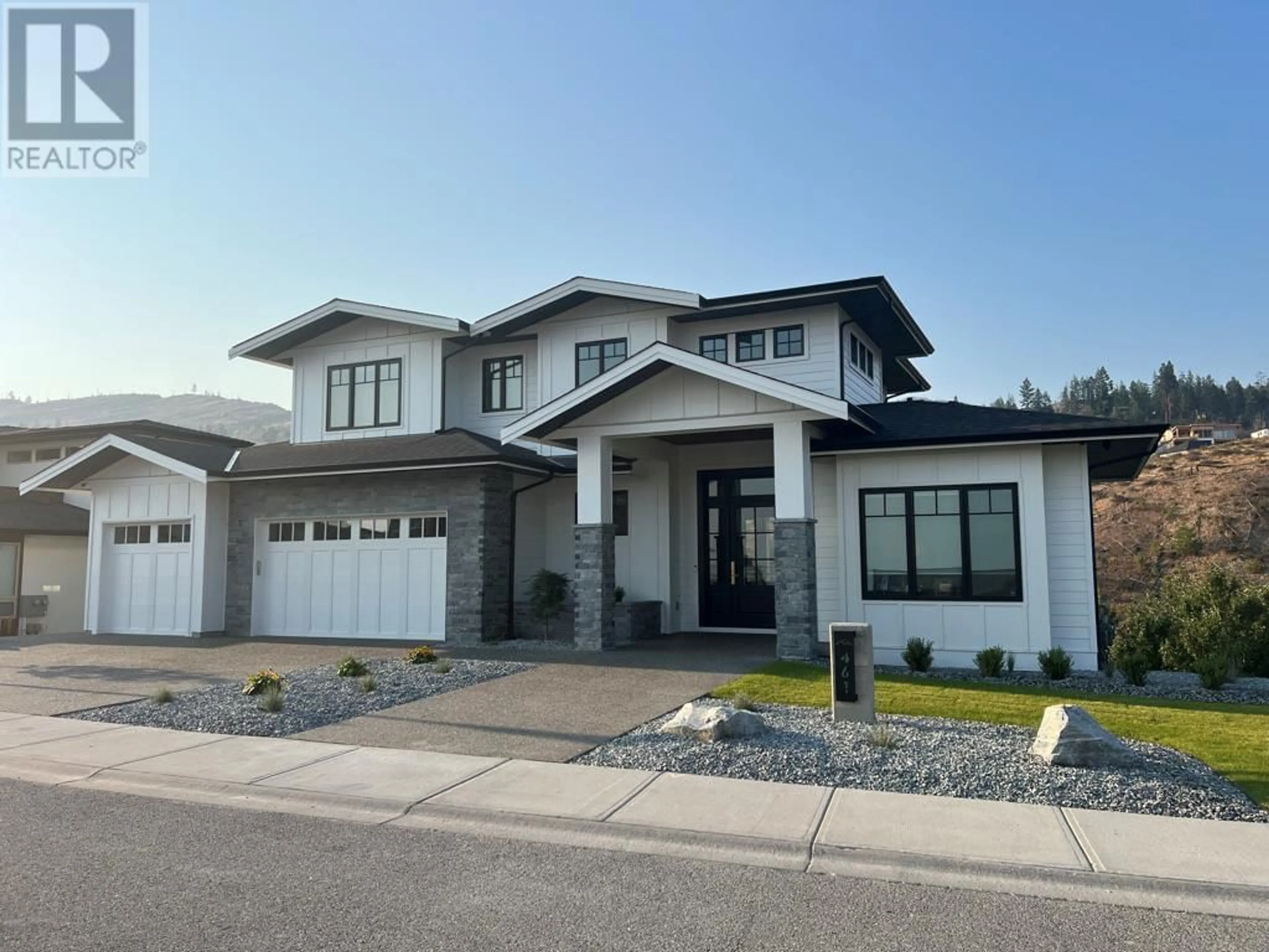 Home with vinyl exterior material, street for 461 Swan Drive, Kelowna British Columbia V1W5L9