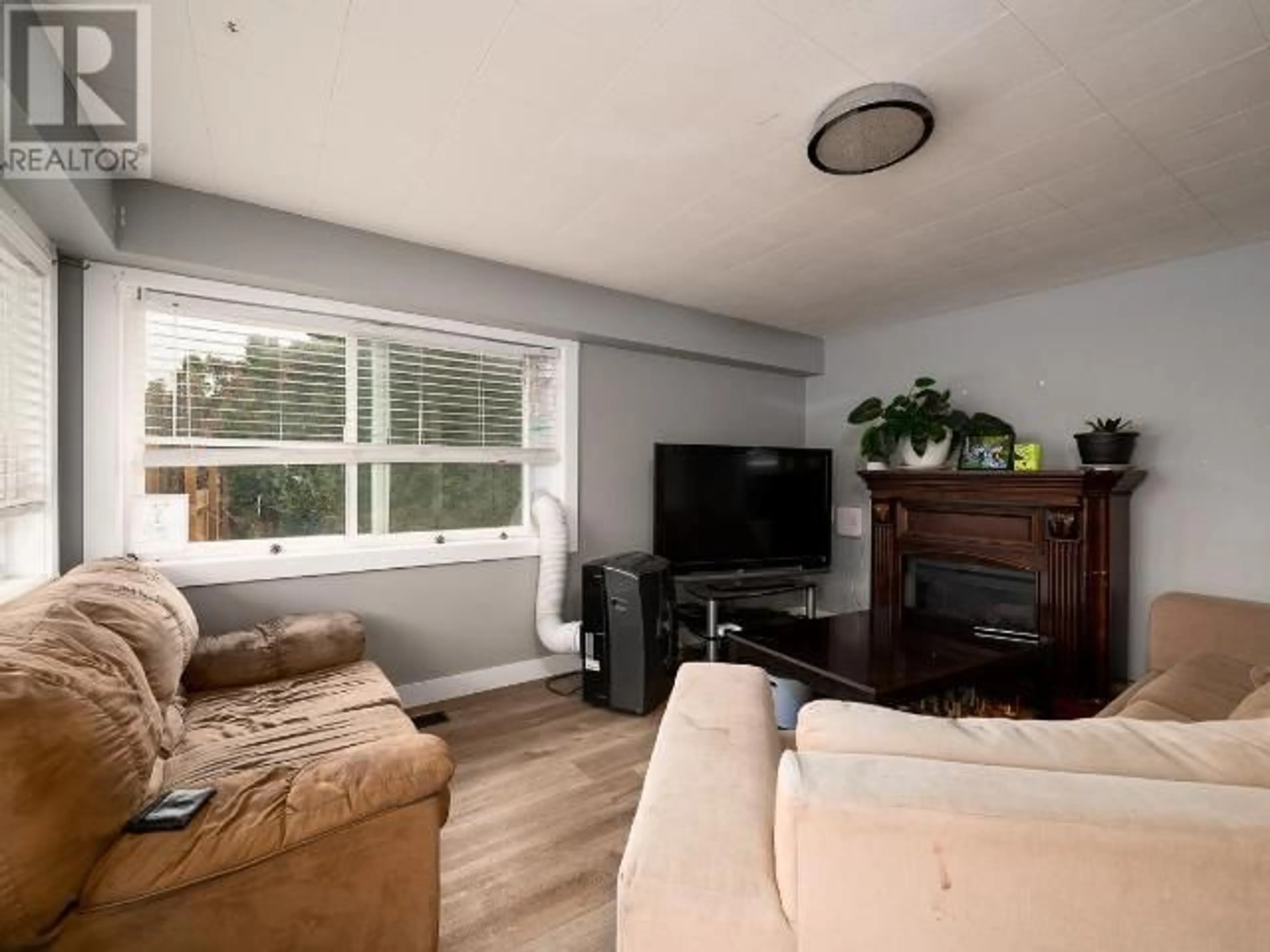 Living room with furniture, wood/laminate floor for 2319 TRANQUILLE ROAD, Kamloops British Columbia V2B3N6