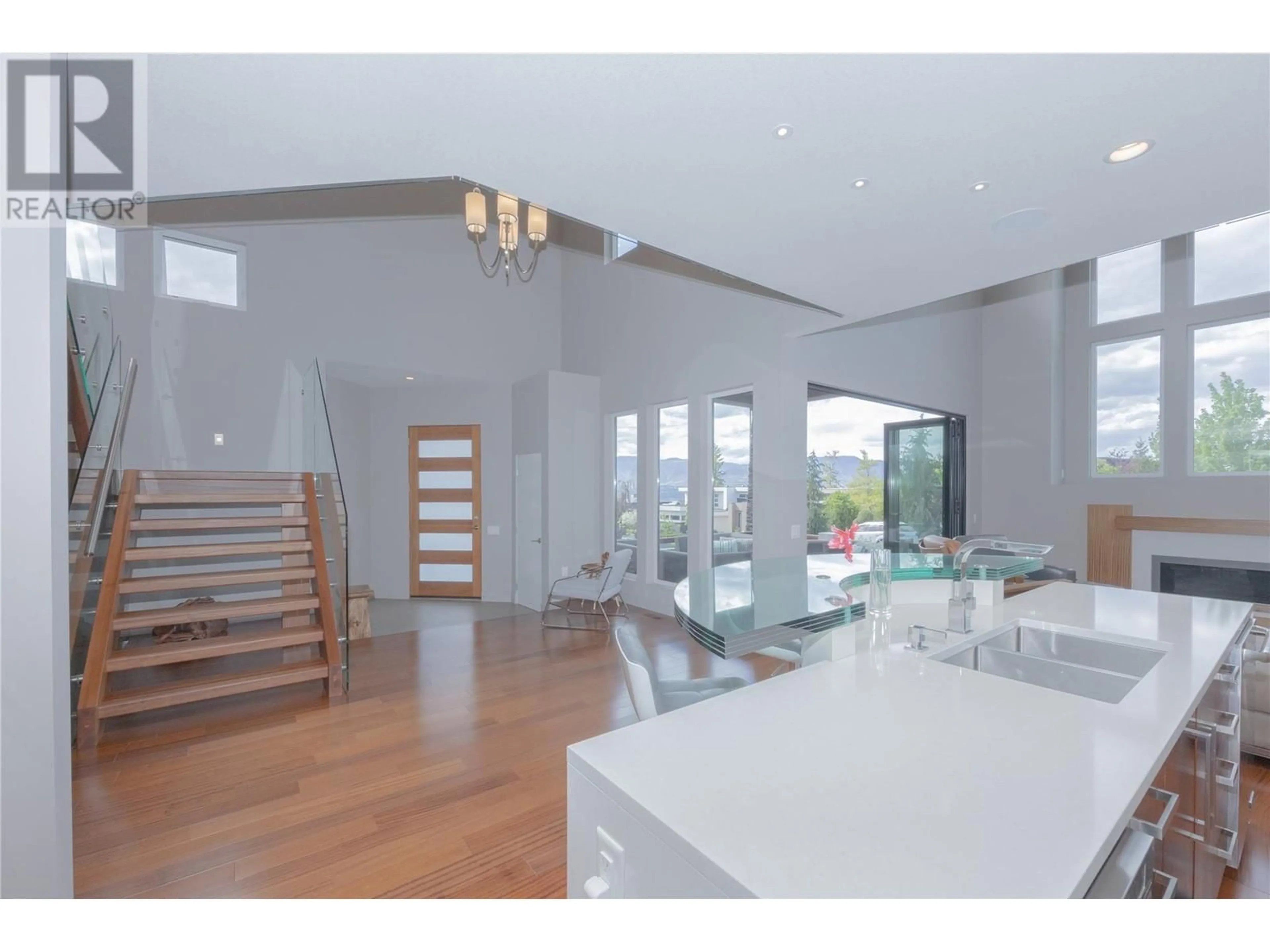 Open concept kitchen, wood/laminate floor for 1067 WESTPOINT DRIVE, Kelowna British Columbia V1W4Z9