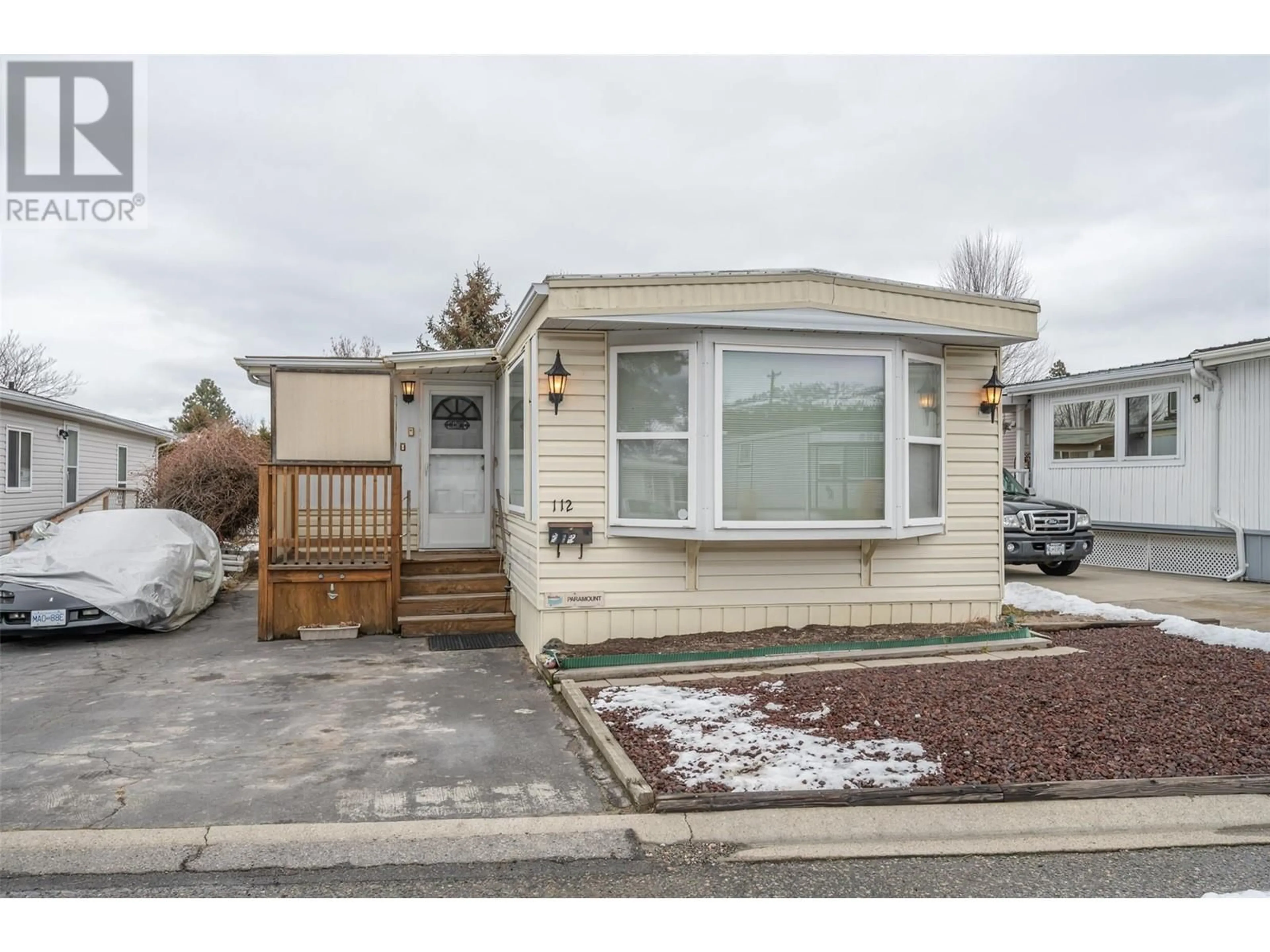 Home with vinyl exterior material, street for 98 Okanagan Avenue E Unit# 112, Penticton British Columbia V2A3J5