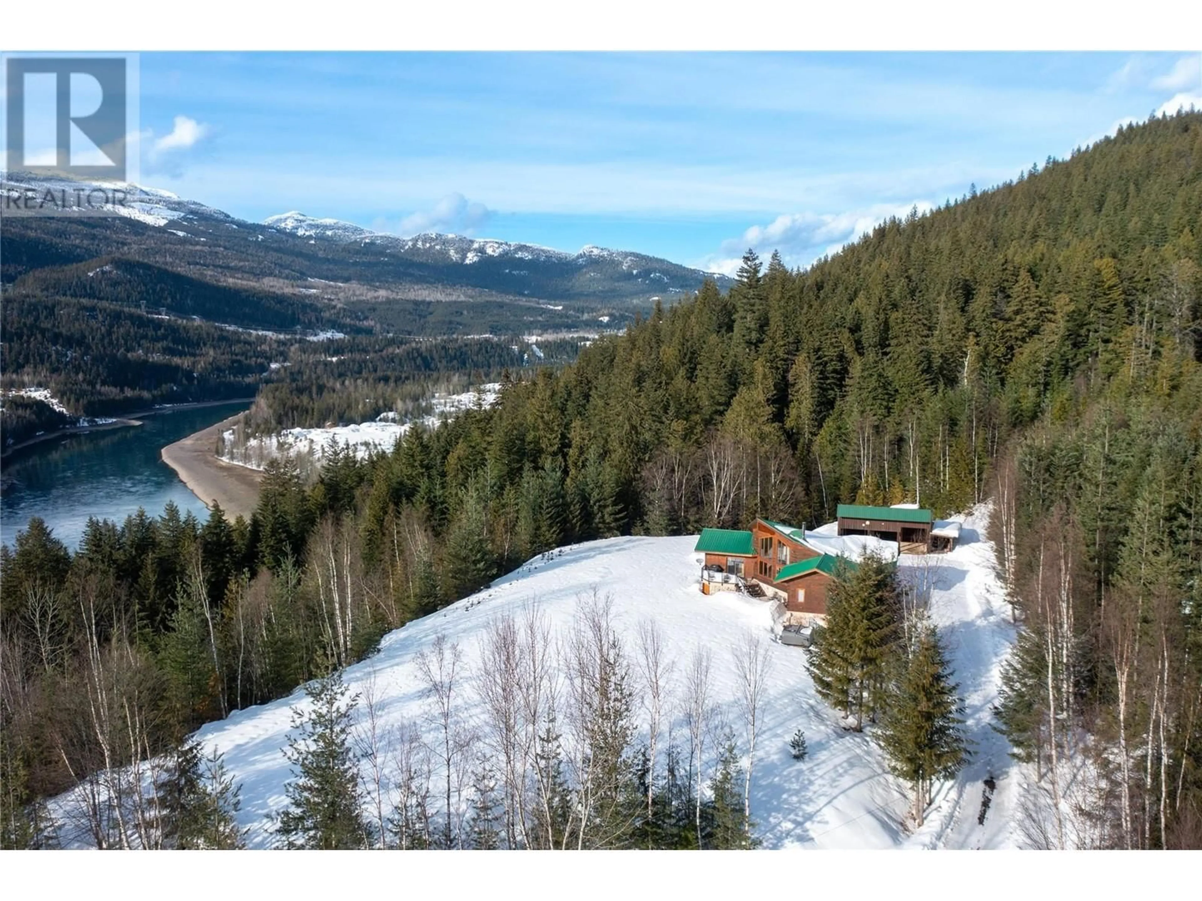 A pic from outside/outdoor area/front of a property/back of a property/a pic from drone, mountain view for 600 Highway 23 North, Revelstoke British Columbia V0E2S0