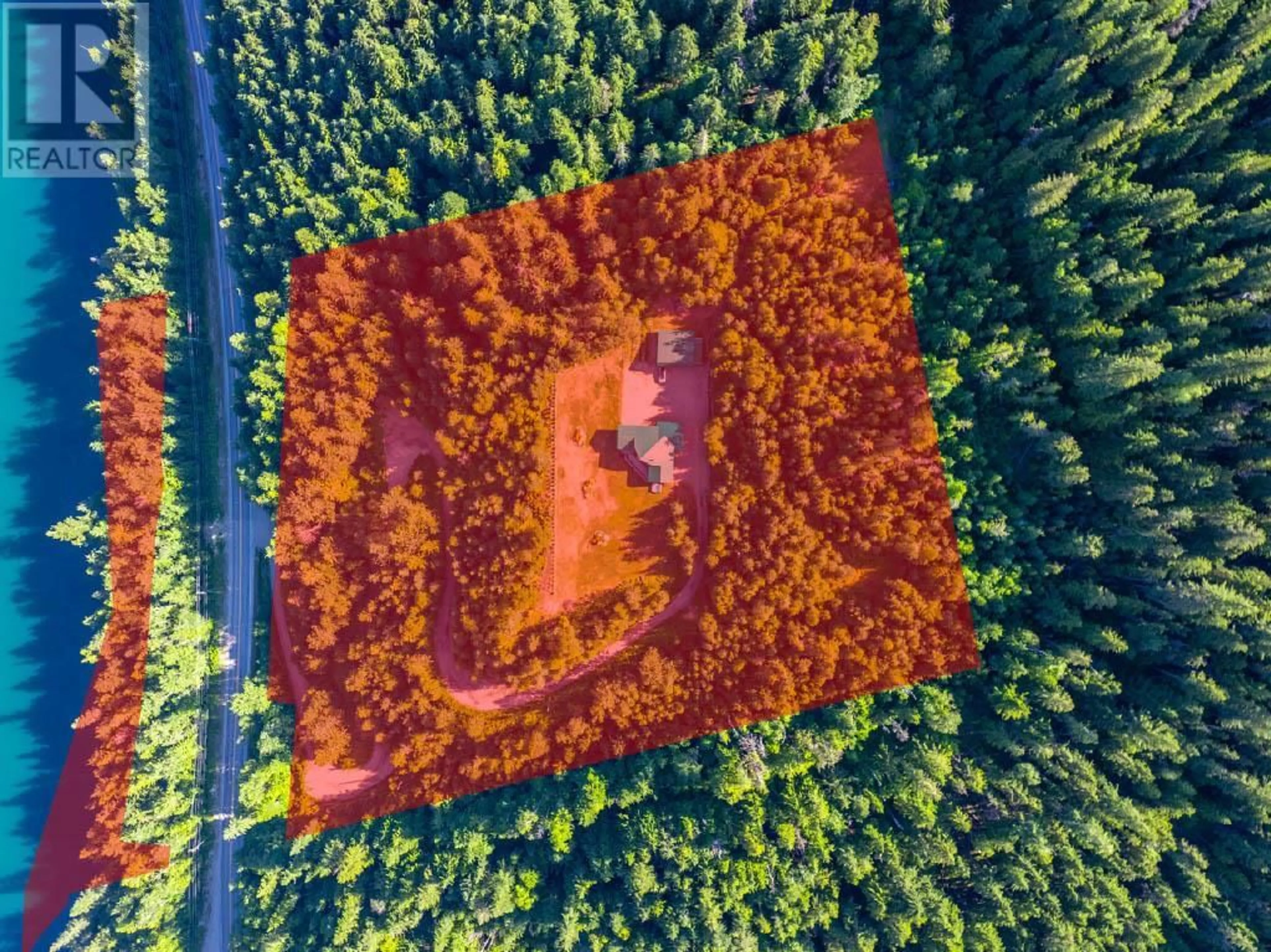 A pic from outside/outdoor area/front of a property/back of a property/a pic from drone, forest/trees view for 600 Highway 23 North, Revelstoke British Columbia V0E2S0