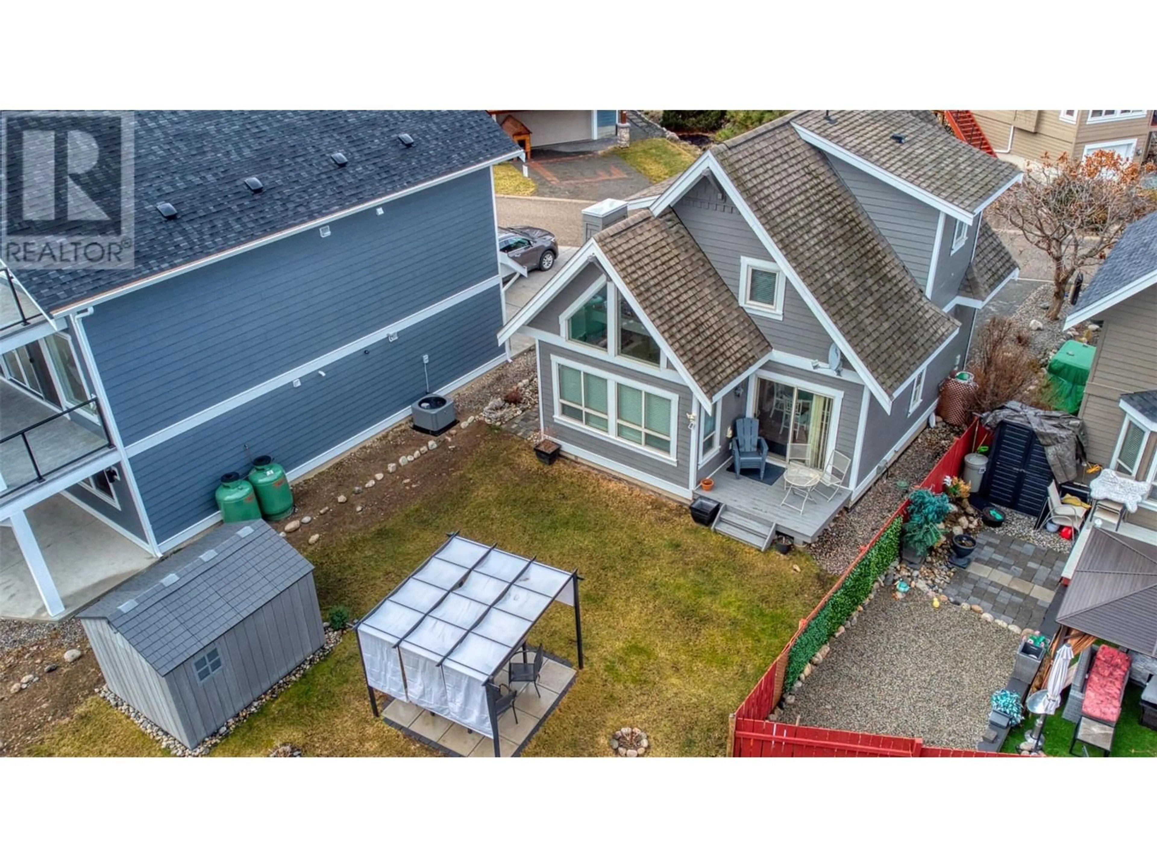 A pic from outside/outdoor area/front of a property/back of a property/a pic from drone, unknown for 136 - 6833 SANTIAGO LOOP, Kelowna British Columbia V1Z3R8