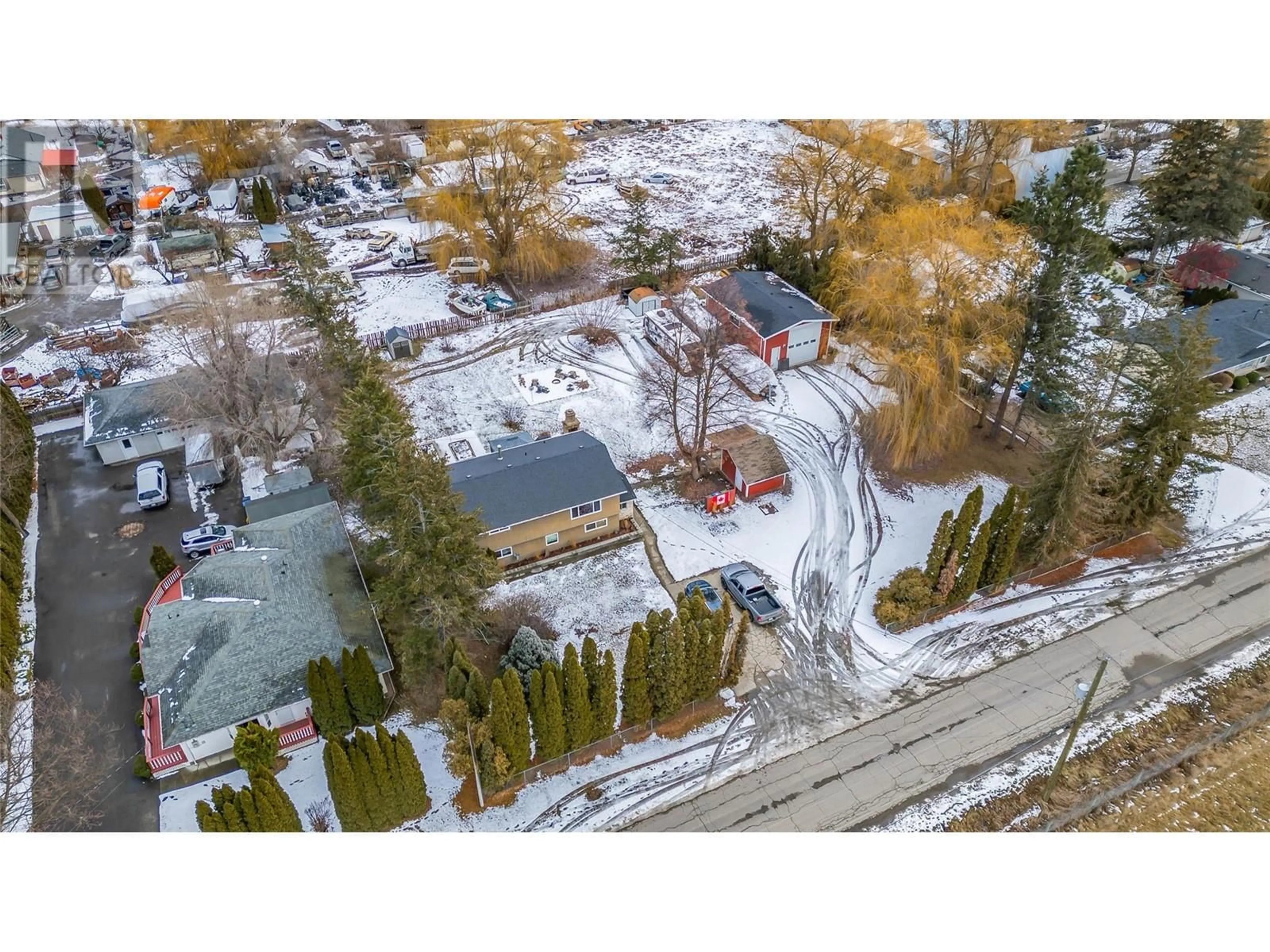 A pic from outside/outdoor area/front of a property/back of a property/a pic from drone, street for 11441 Reiswig Road, Lake Country British Columbia V4V1Y5