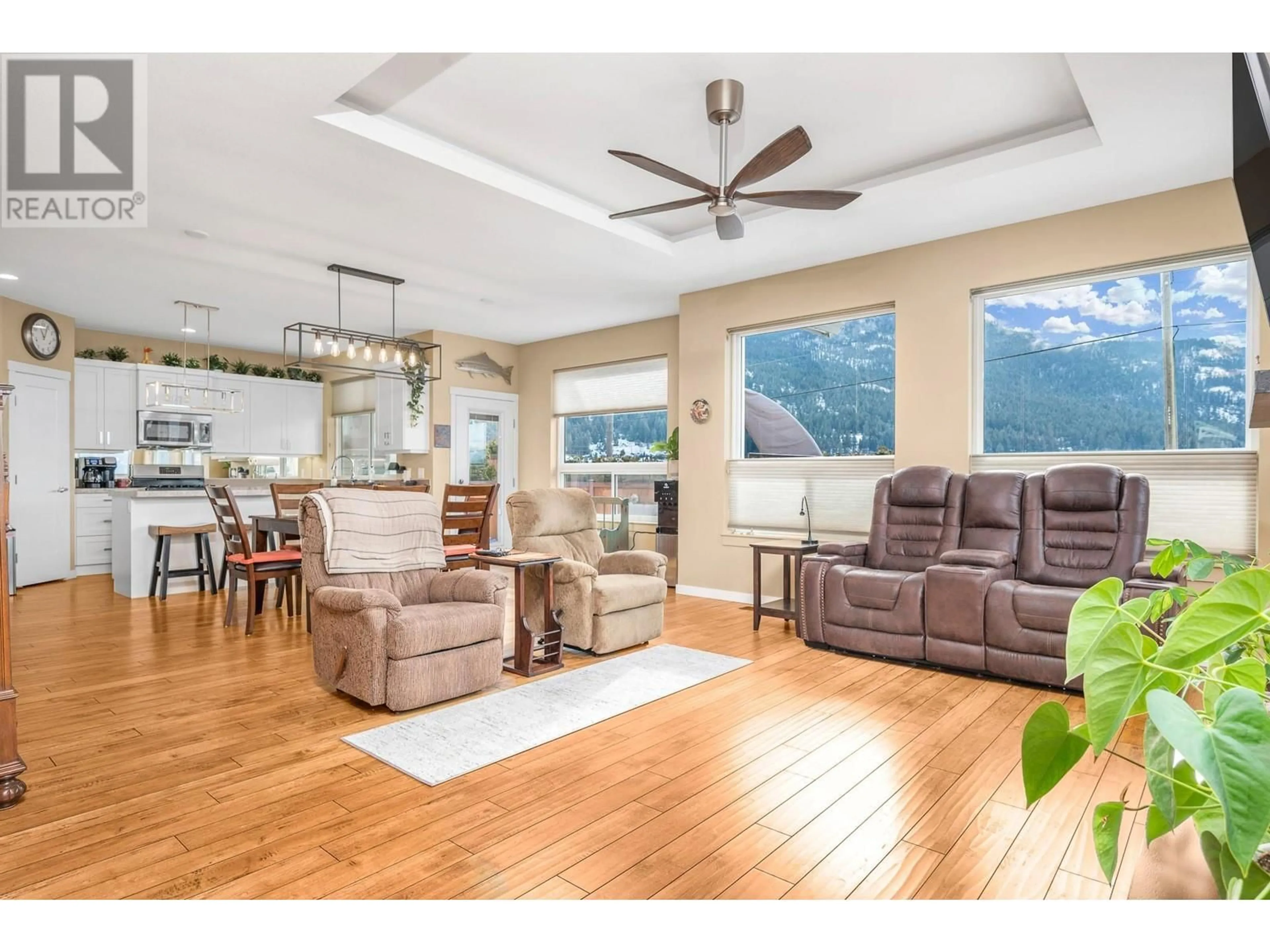 Living room with furniture, wood/laminate floor for 2367 Oglow Drive, Armstrong British Columbia V4Y0V9