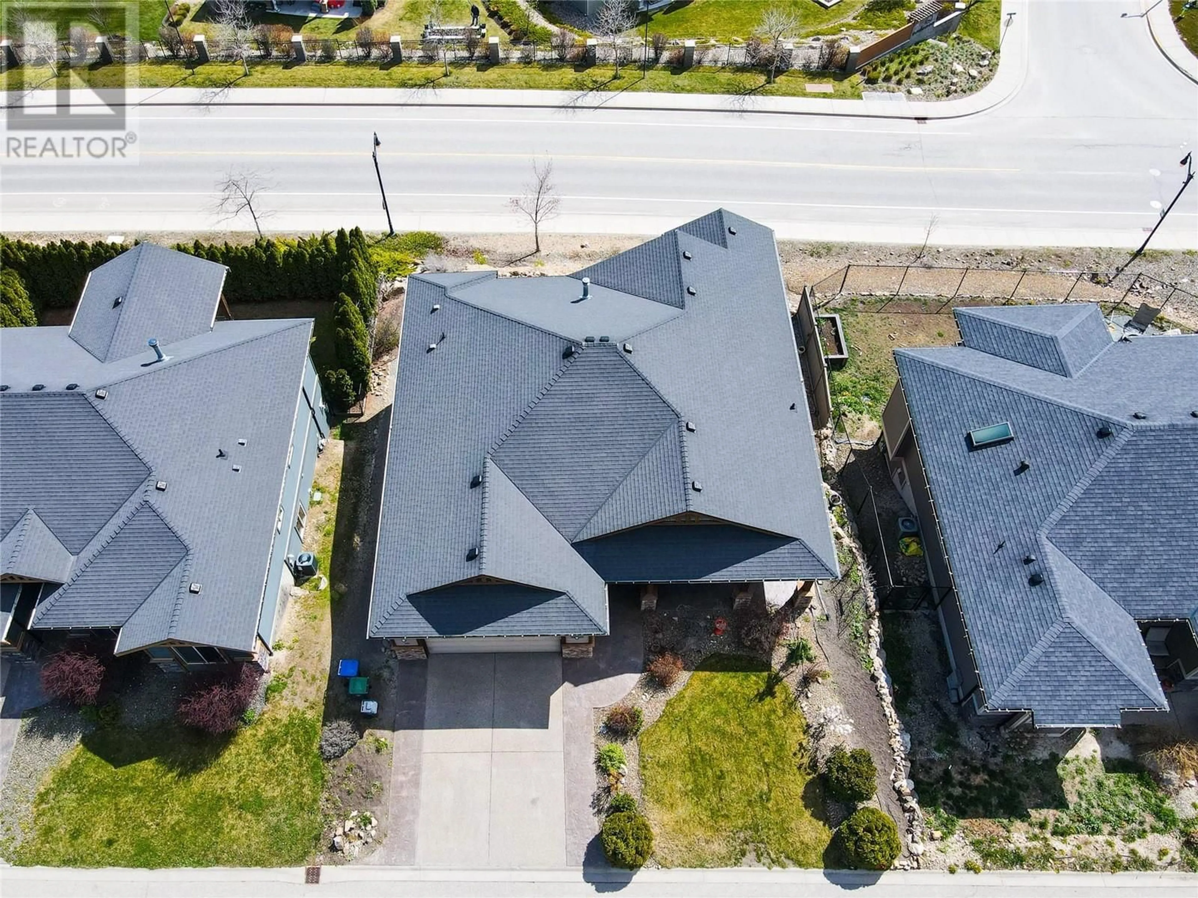 A pic from outside/outdoor area/front of a property/back of a property/a pic from drone, street for 12970 Lake Hill Drive, Lake Country British Columbia V4V2P7