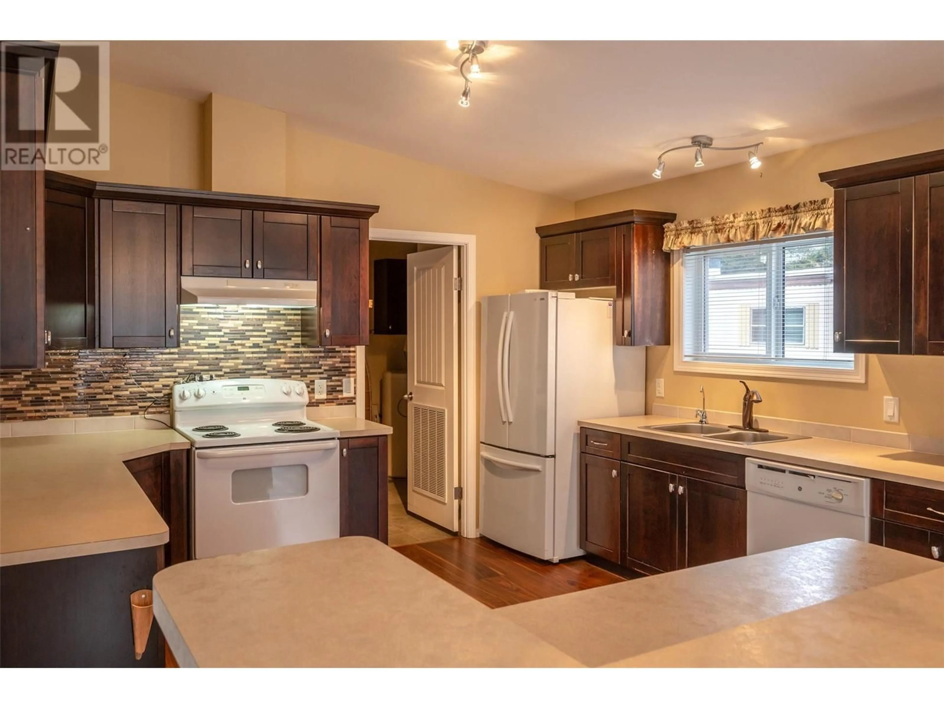 Open concept kitchen, wood/laminate floor for 7 - 1302 CEDAR STREET, Okanagan Falls British Columbia V0H1R0