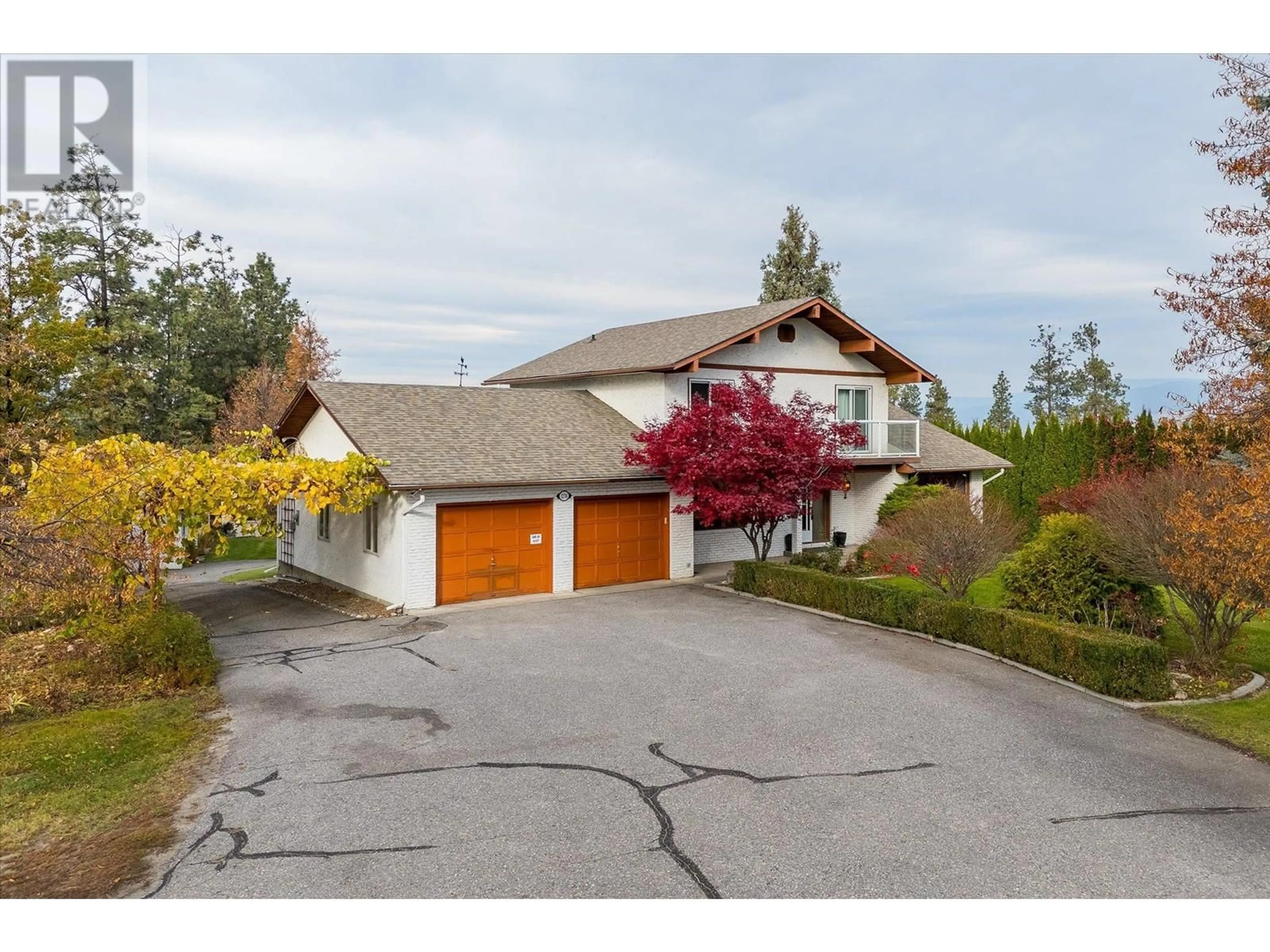 A pic from outside/outdoor area/front of a property/back of a property/a pic from drone, street for 1276 Teasdale Road, Kelowna British Columbia V1P1C7