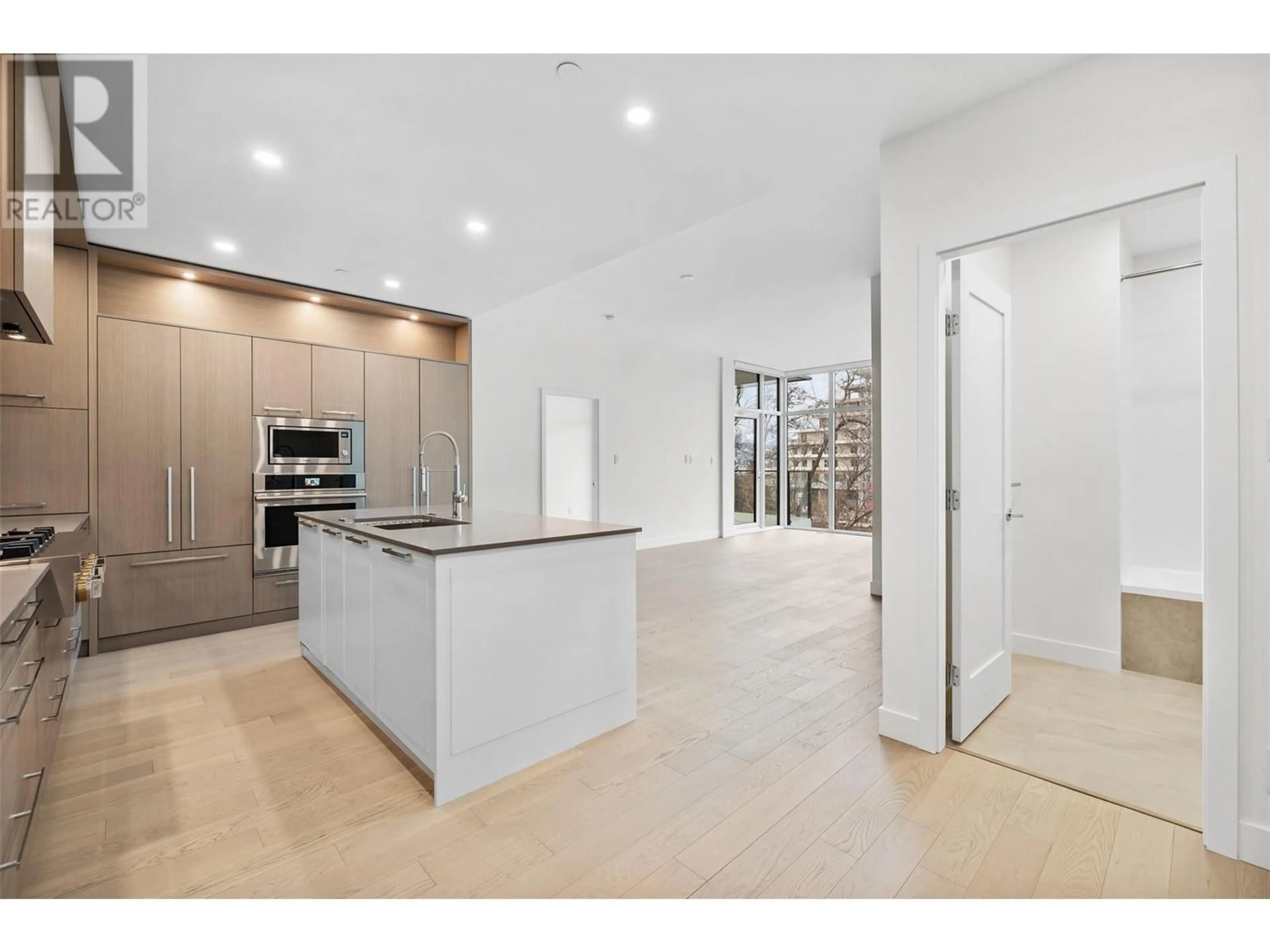 Open concept kitchen, ceramic/tile floor for 3389 Lakeshore Road Unit# 403, Kelowna British Columbia V1W0G5