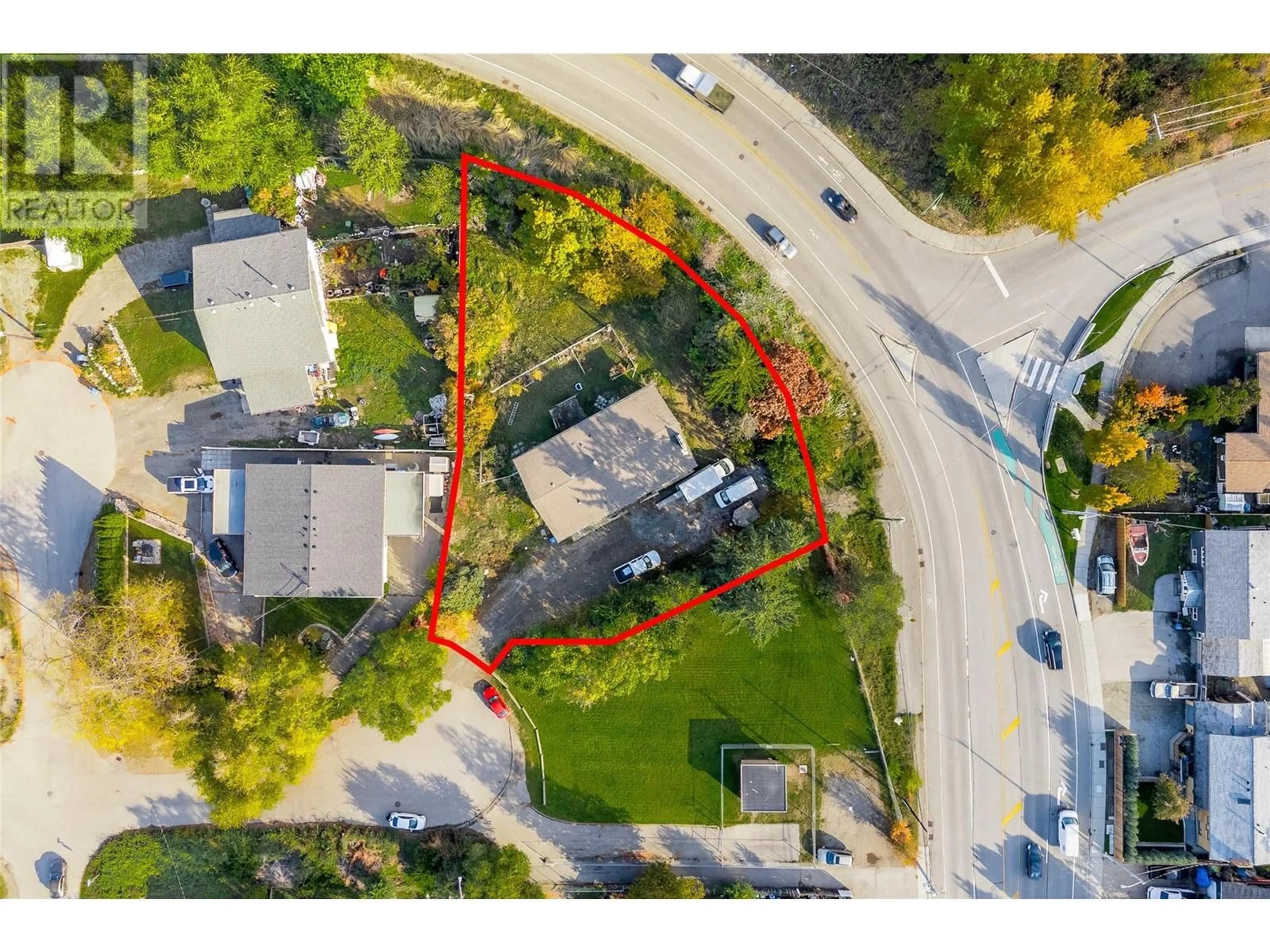 A pic from outside/outdoor area/front of a property/back of a property/a pic from drone, street for 1115 Cactus Road, Kelowna British Columbia V1X5N3