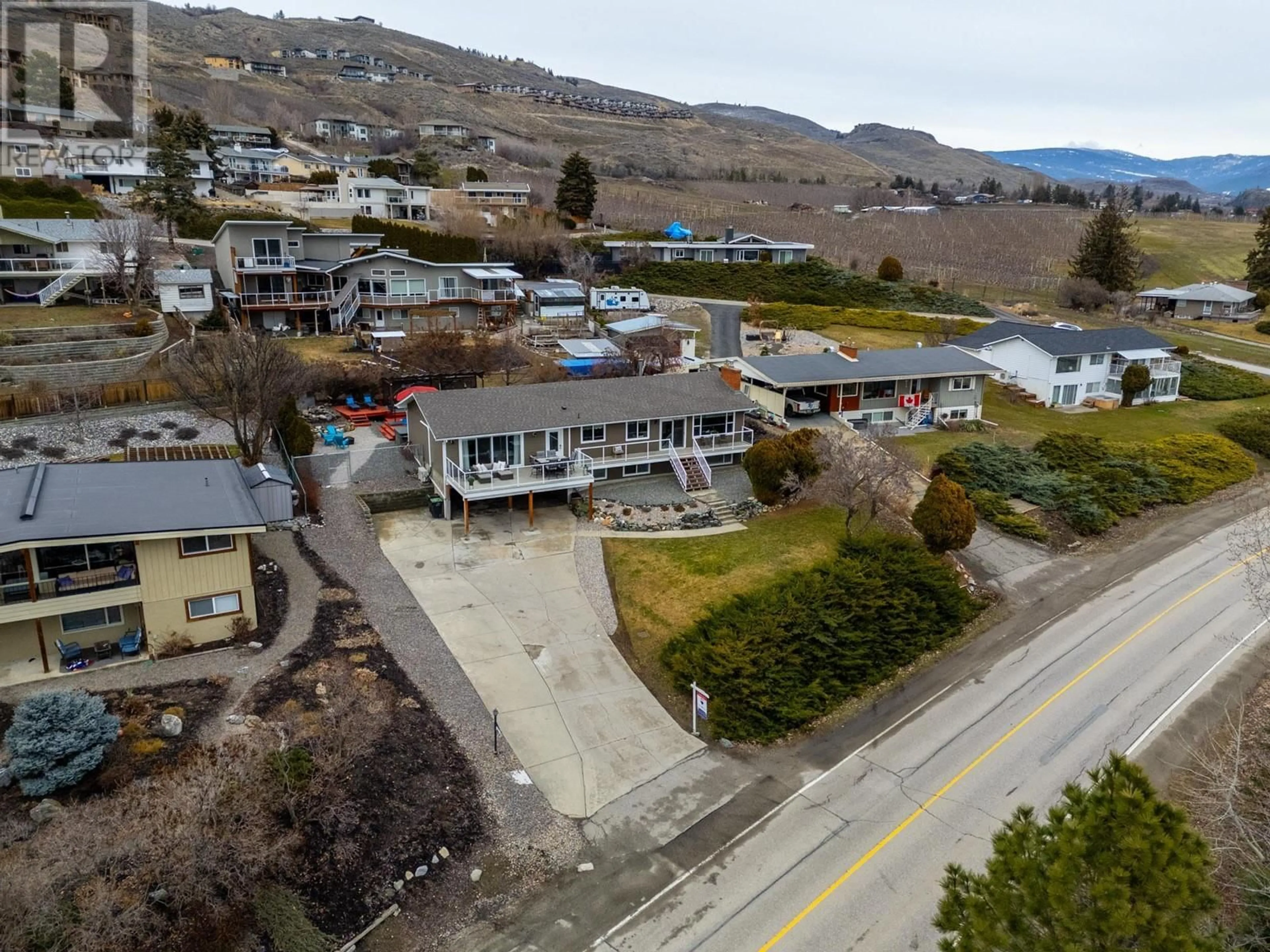 A pic from outside/outdoor area/front of a property/back of a property/a pic from drone, unknown for 7023 Bella Vista Road, Vernon British Columbia V1H1X3