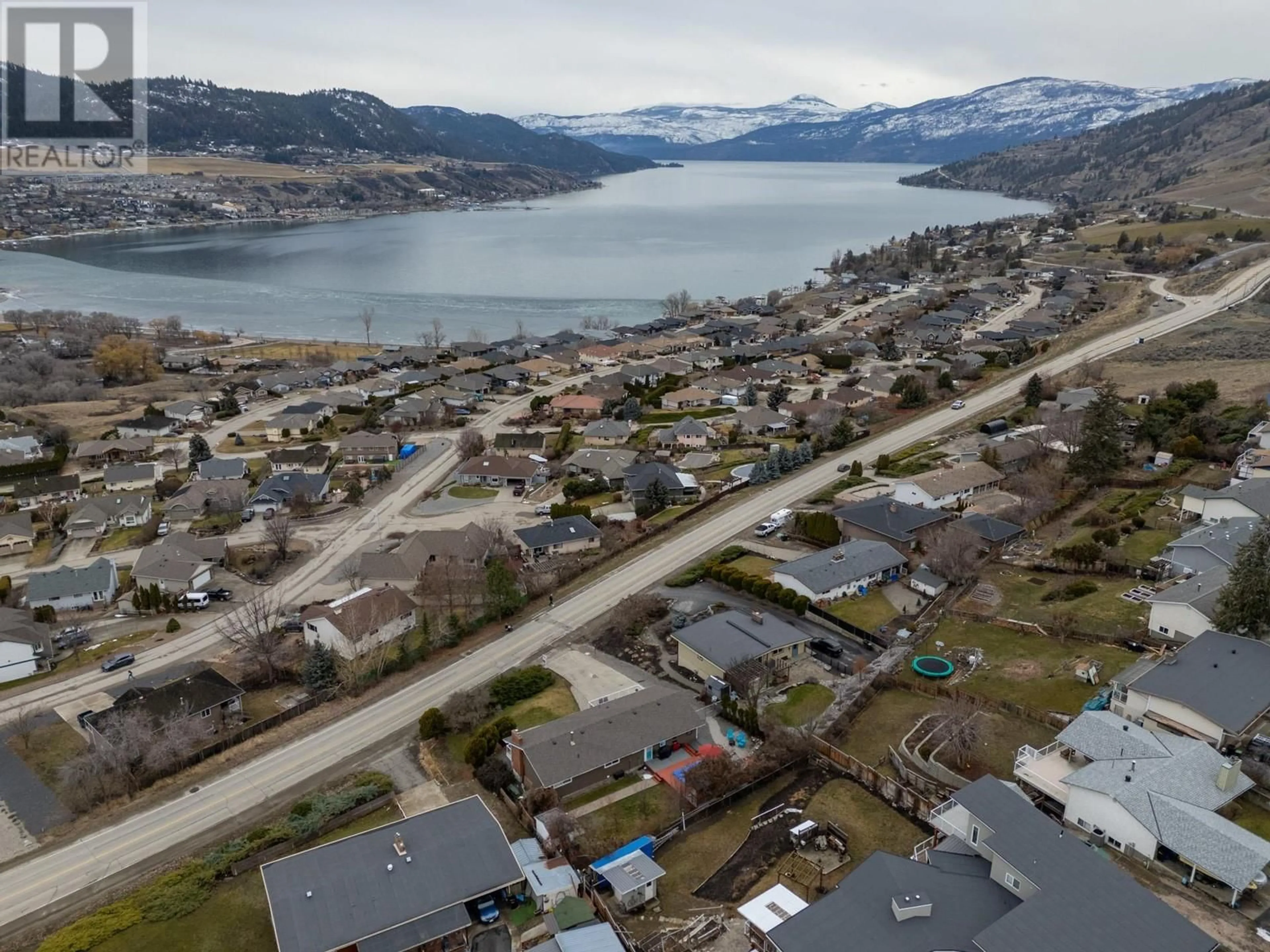 A pic from outside/outdoor area/front of a property/back of a property/a pic from drone, water/lake/river/ocean view for 7023 Bella Vista Road, Vernon British Columbia V1H1X3