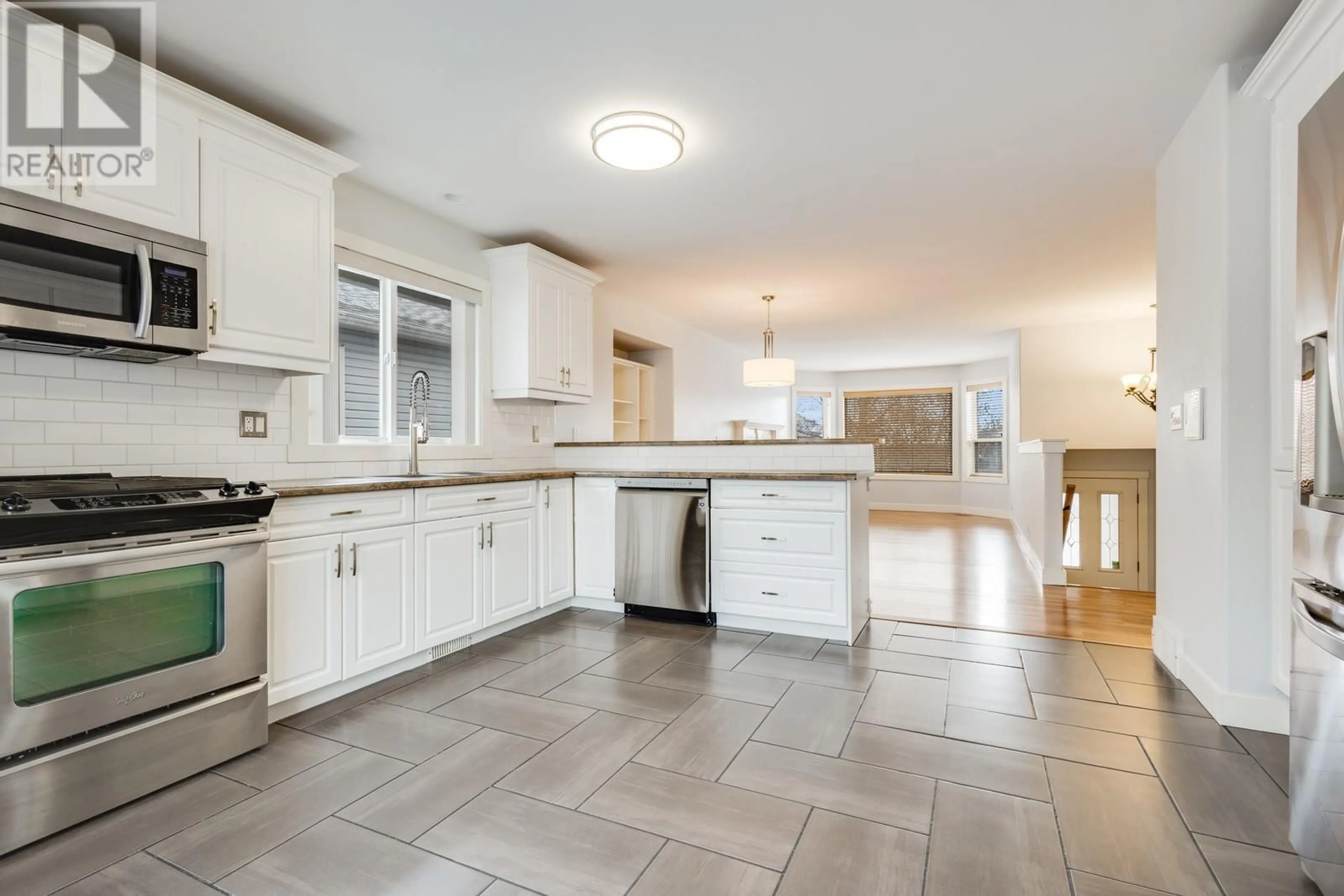 Open concept kitchen, ceramic/tile floor for 174 Ritchie Court, Kelowna British Columbia V1V2A8