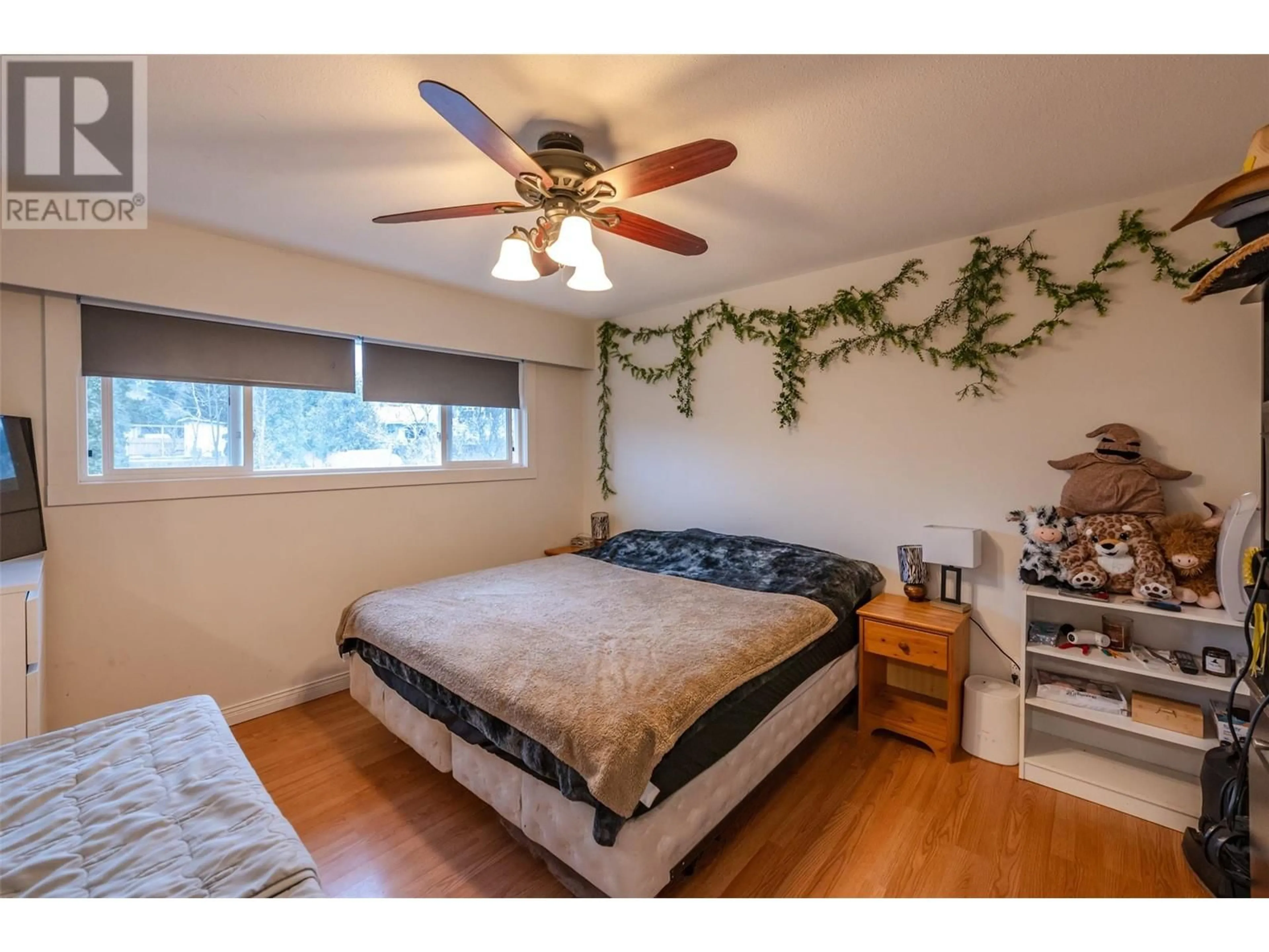 Bedroom with bed, wood/laminate floor for 1470 CARMI DRIVE, Penticton British Columbia V2A4S1
