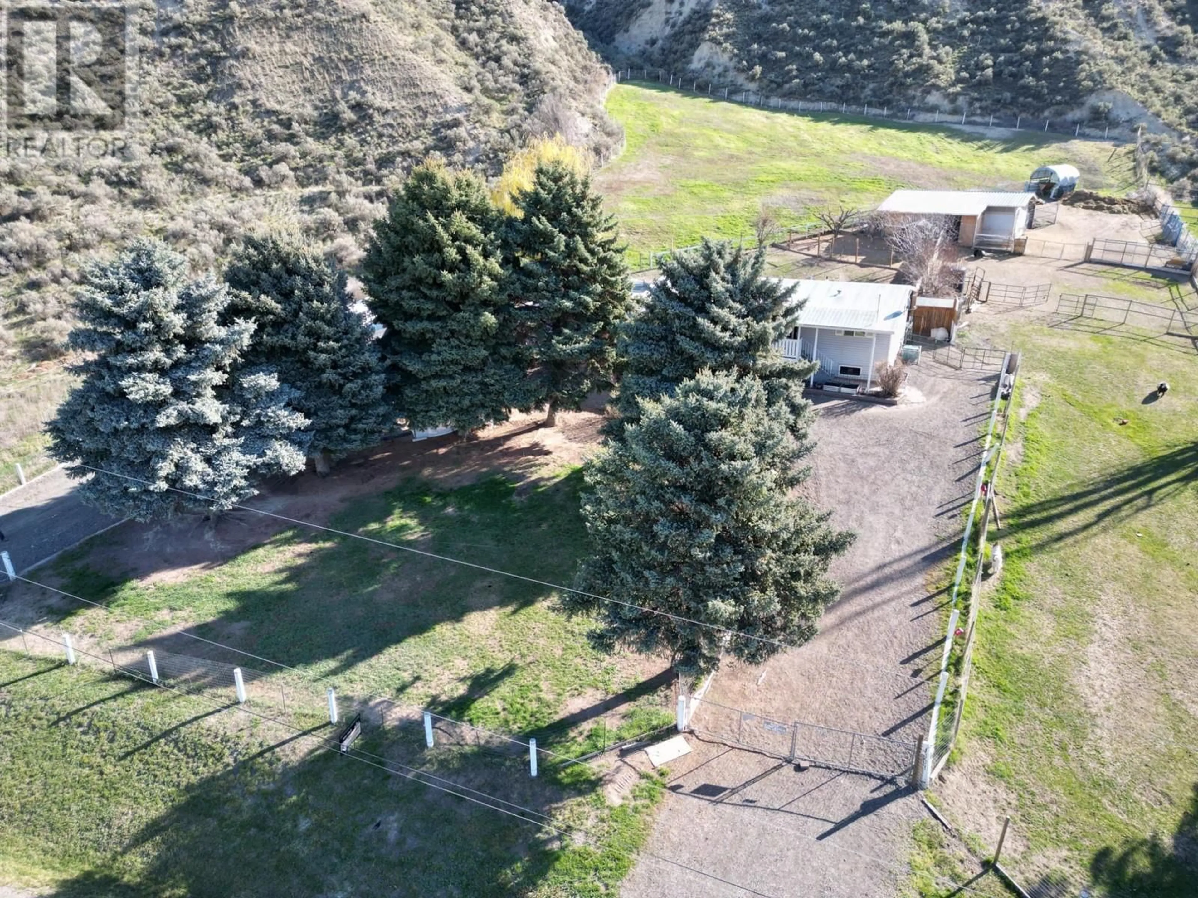 A pic from outside/outdoor area/front of a property/back of a property/a pic from drone, mountain view for 4001 SHUSWAP Road, Kamloops British Columbia V2H1S7