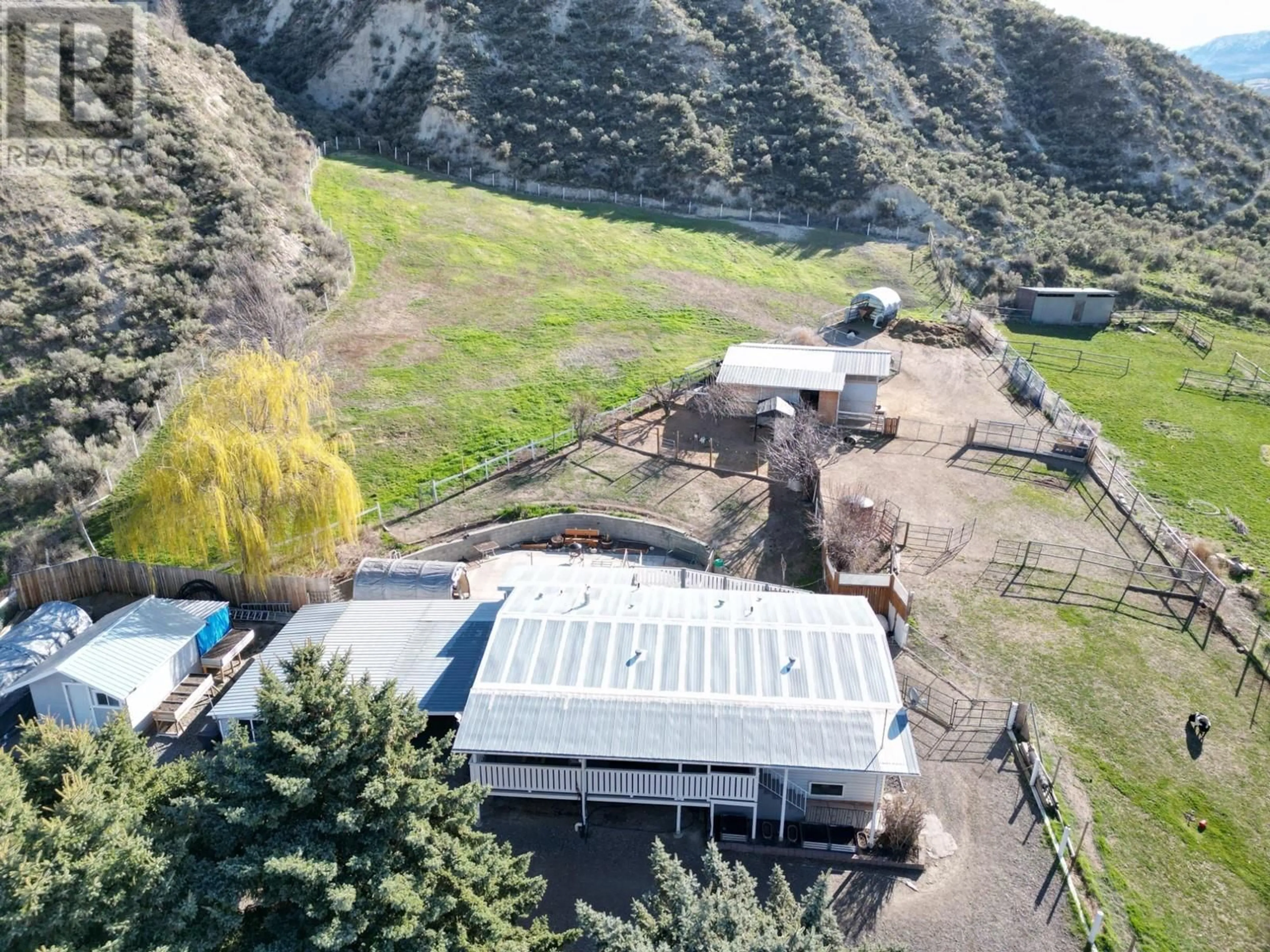 A pic from outside/outdoor area/front of a property/back of a property/a pic from drone, mountain view for 4001 SHUSWAP Road, Kamloops British Columbia V2H1S7