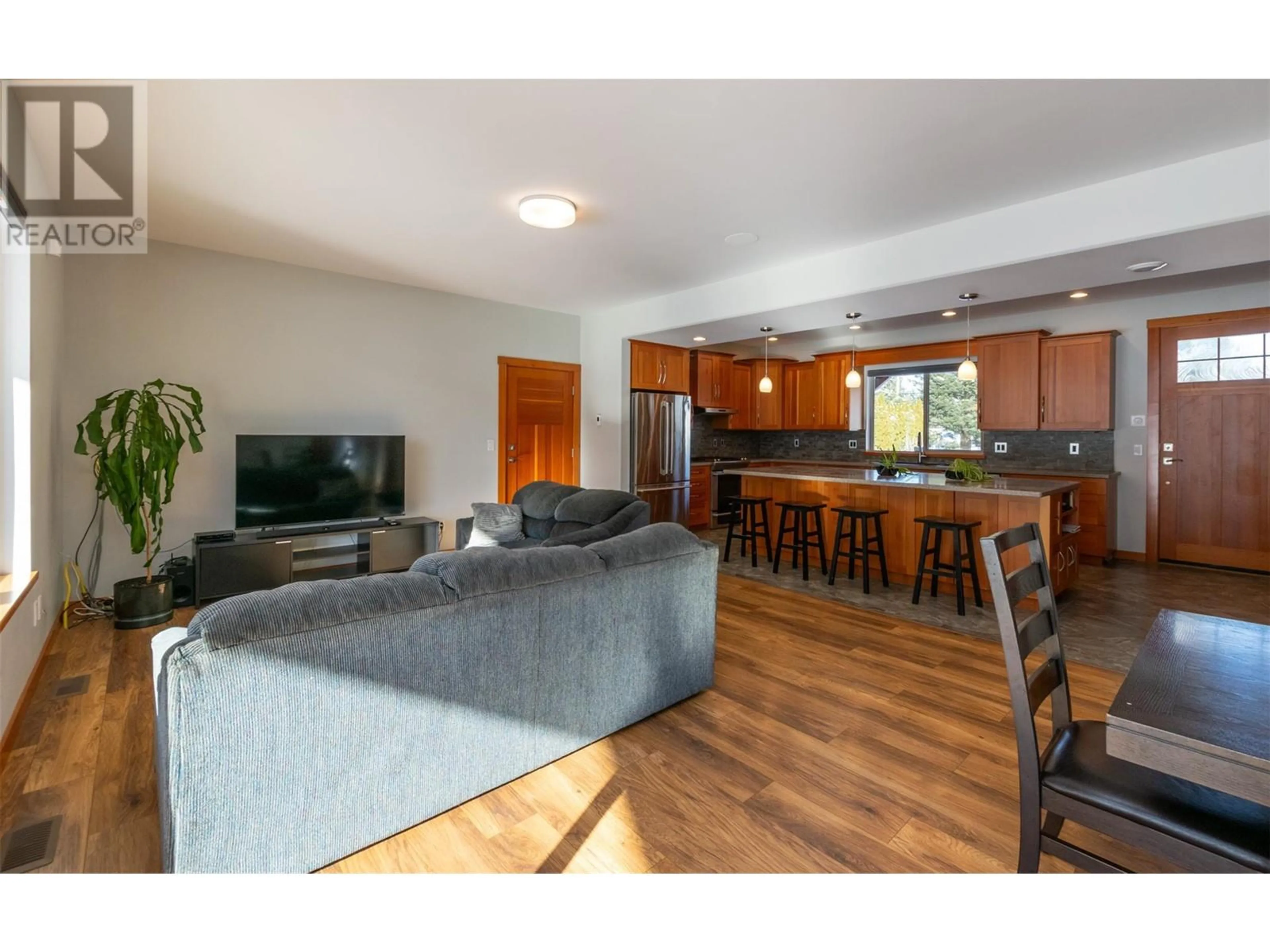 Open concept kitchen, wood/laminate floor for 1690 20 AVENUE SOUTHEAST, Salmon Arm British Columbia V1E2M9