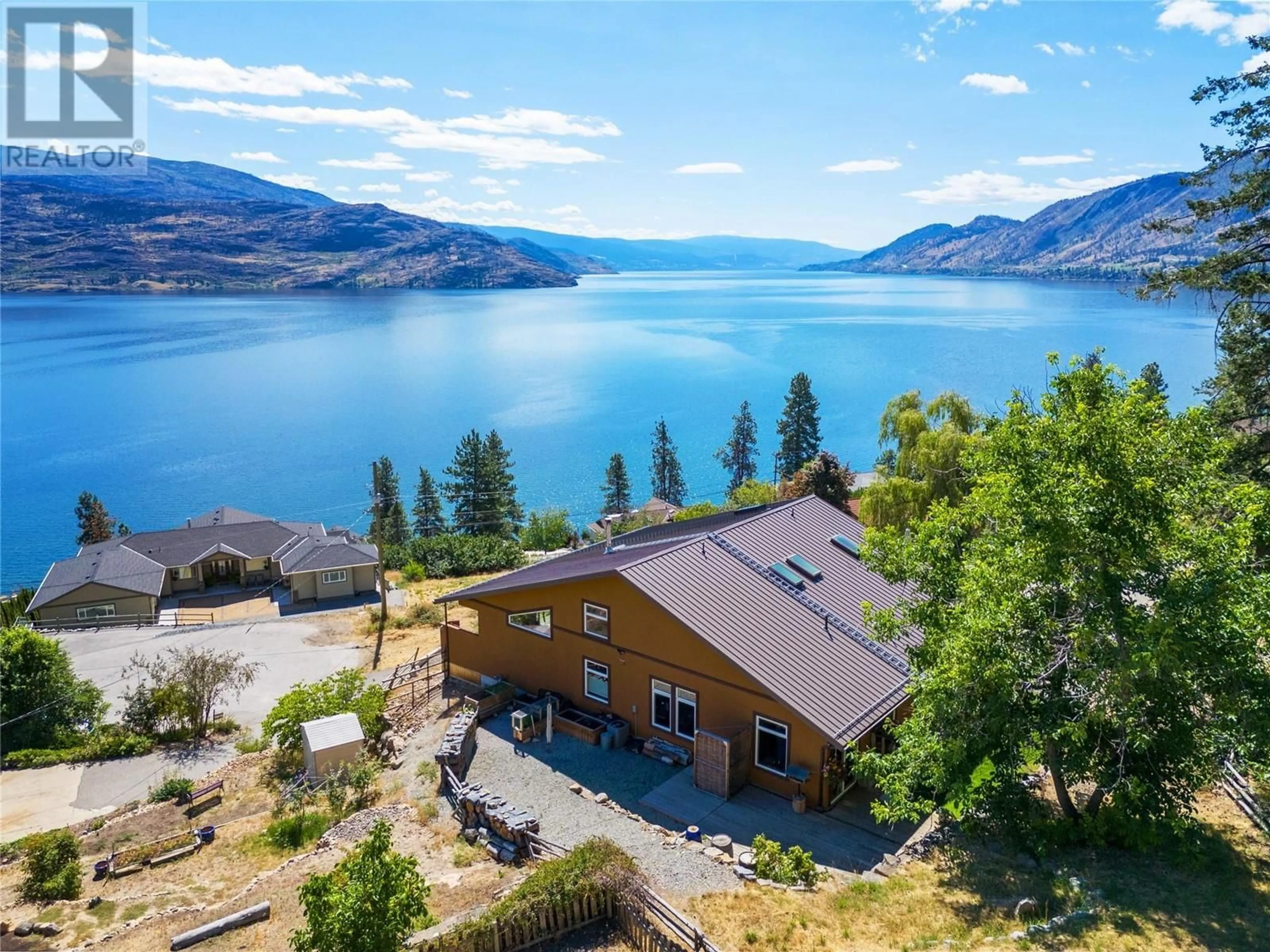 A pic from outside/outdoor area/front of a property/back of a property/a pic from drone, water/lake/river/ocean view for 6376 TOPHAM PLACE, Peachland British Columbia V0H1X7