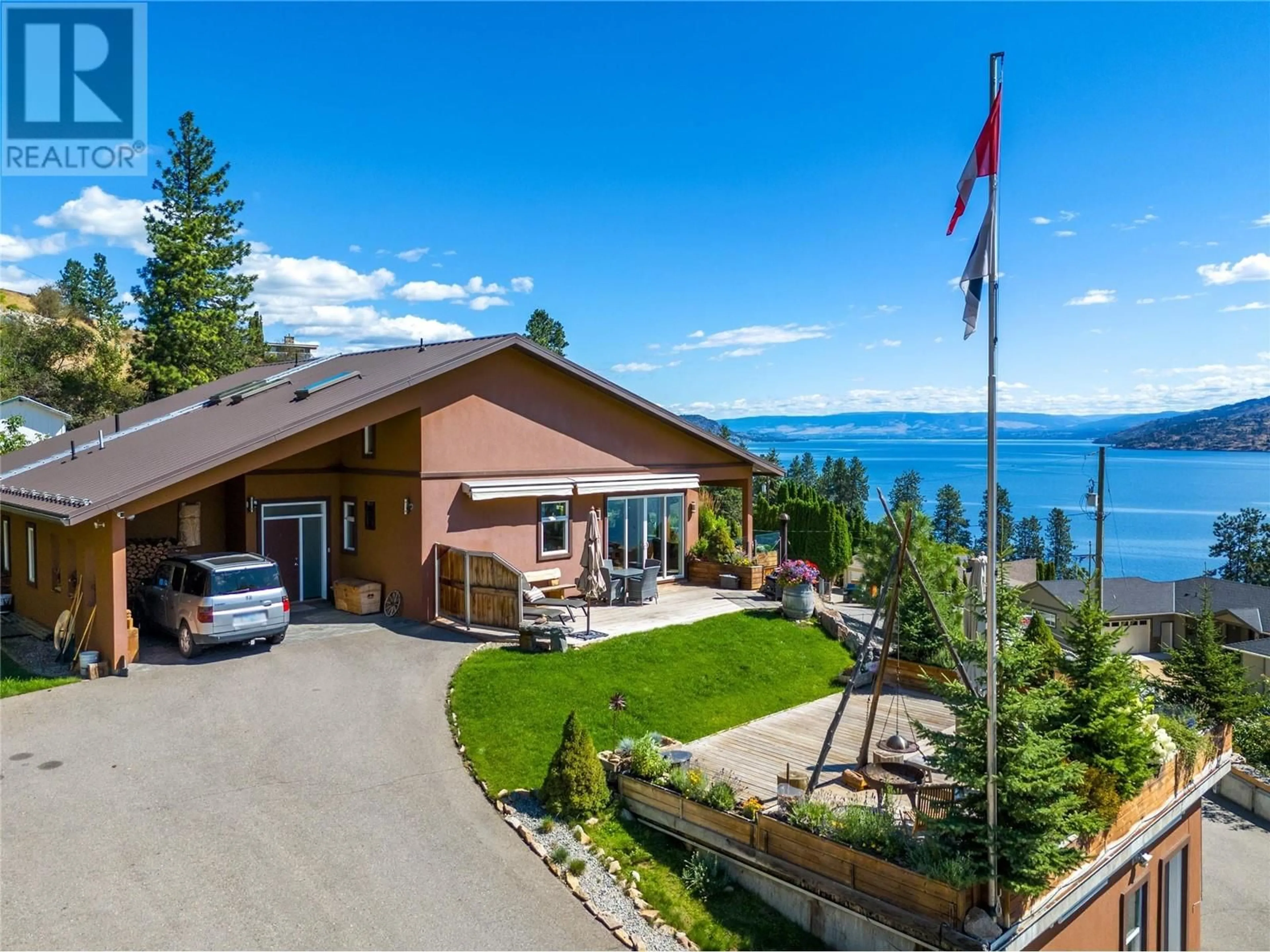 A pic from outside/outdoor area/front of a property/back of a property/a pic from drone, water/lake/river/ocean view for 6376 TOPHAM PLACE, Peachland British Columbia V0H1X7