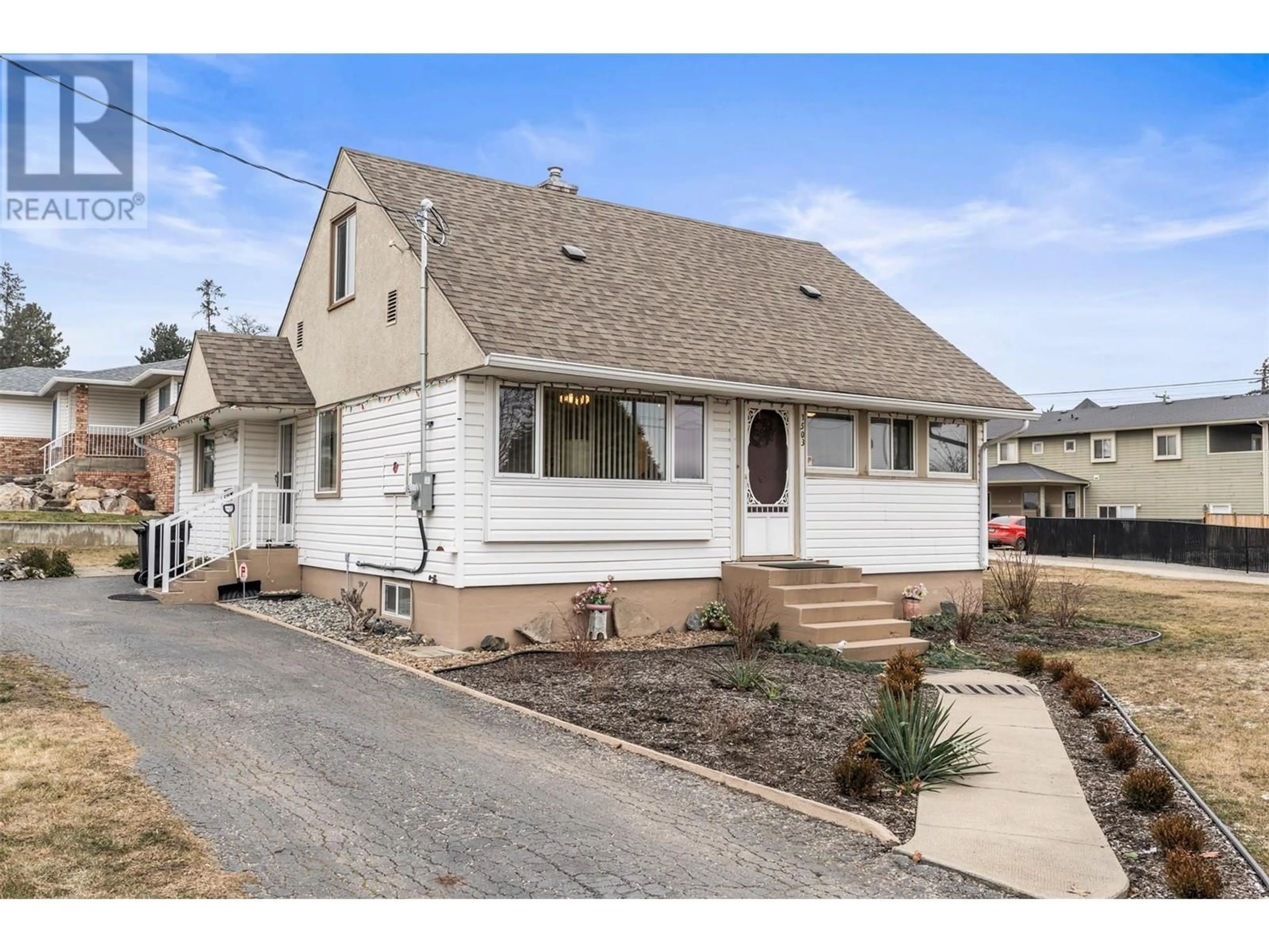 Home with vinyl exterior material, street for 1503 25TH AVENUE, Vernon British Columbia V1T1M6