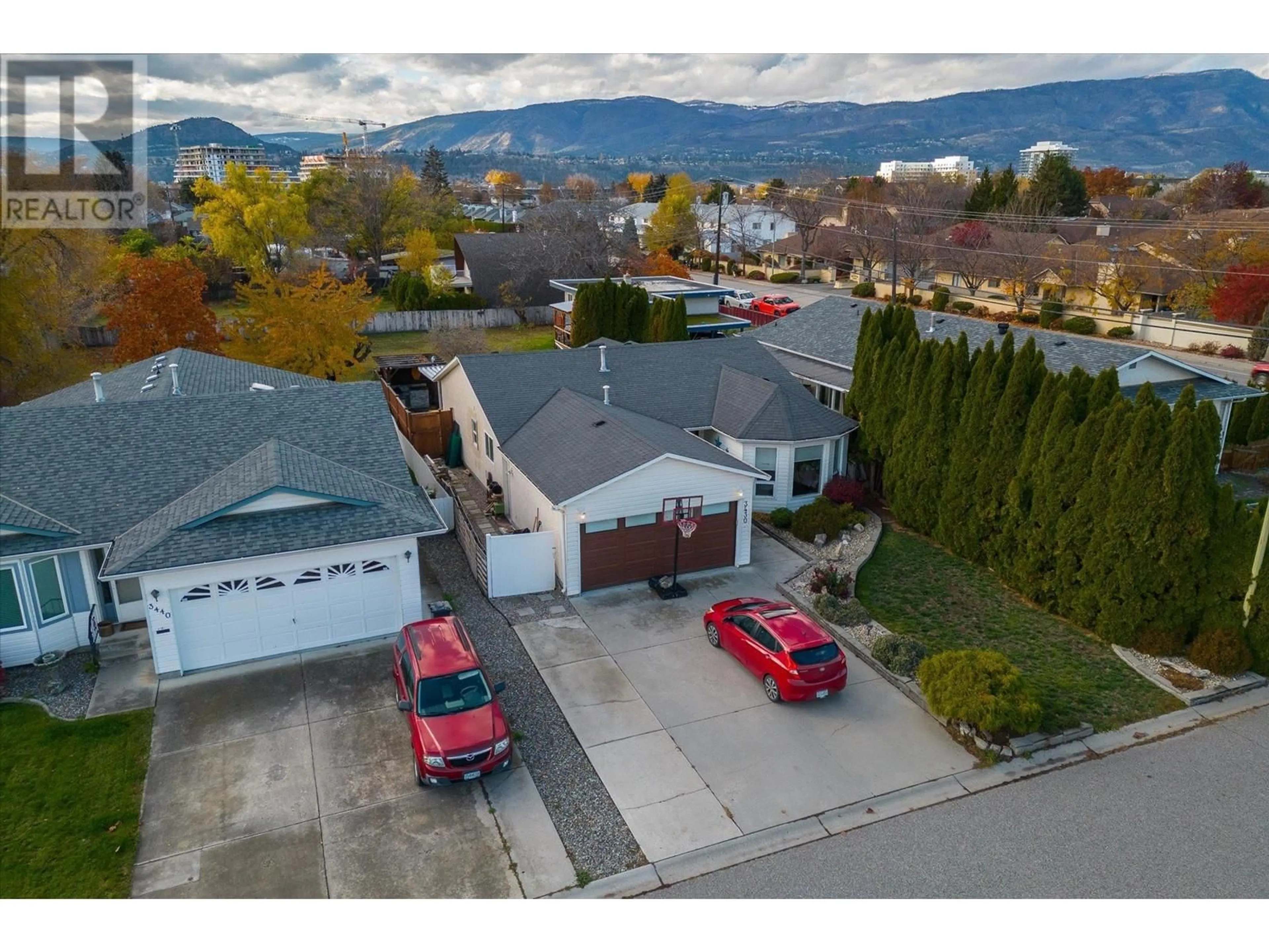 A pic from outside/outdoor area/front of a property/back of a property/a pic from drone, mountain view for 3430 Silverberry Road, Kelowna British Columbia V1W3V5