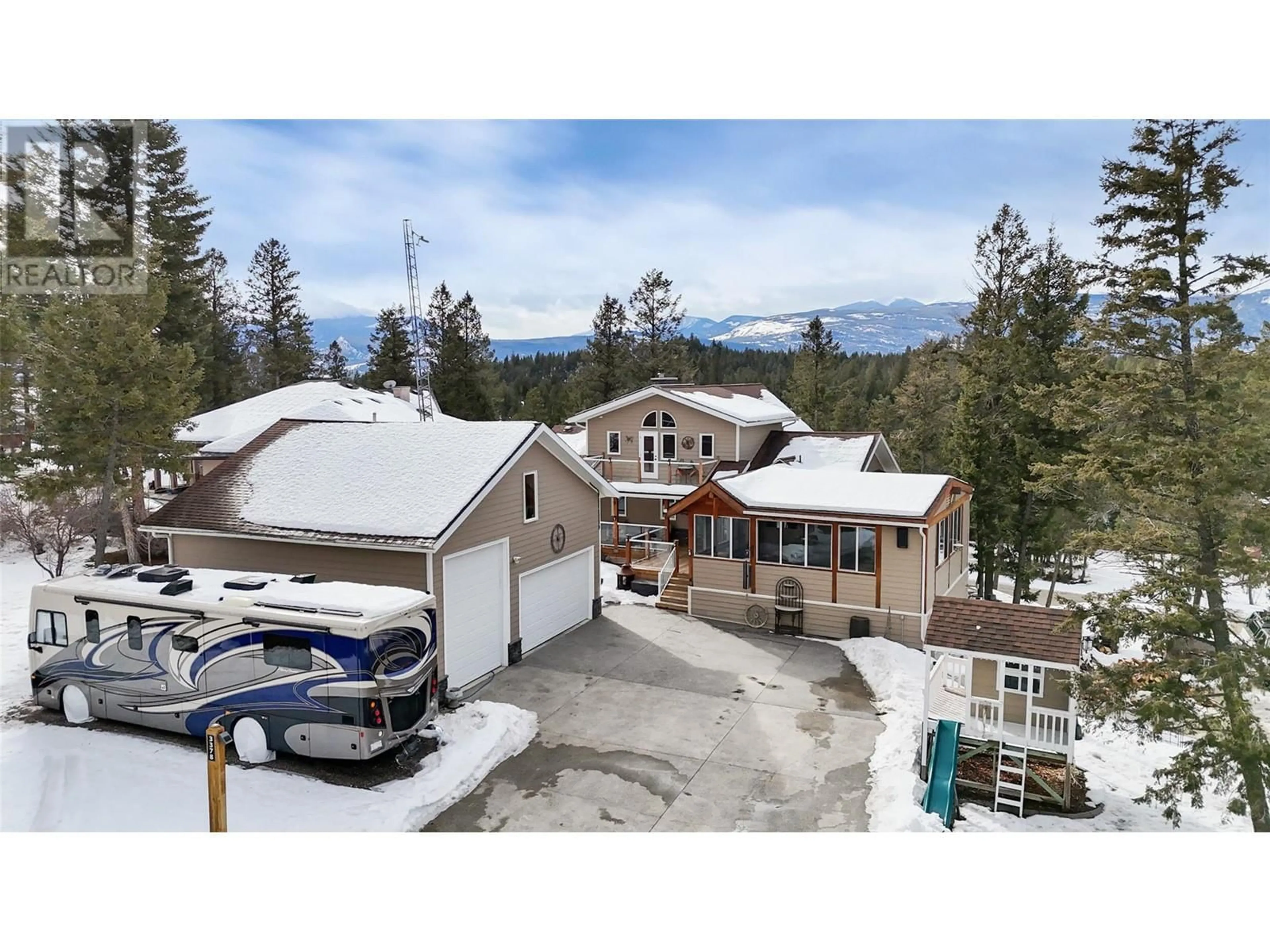 A pic from outside/outdoor area/front of a property/back of a property/a pic from drone, mountain view for 3378 Crooked Tree Place, Fairmont Hot Springs British Columbia V0B1L1