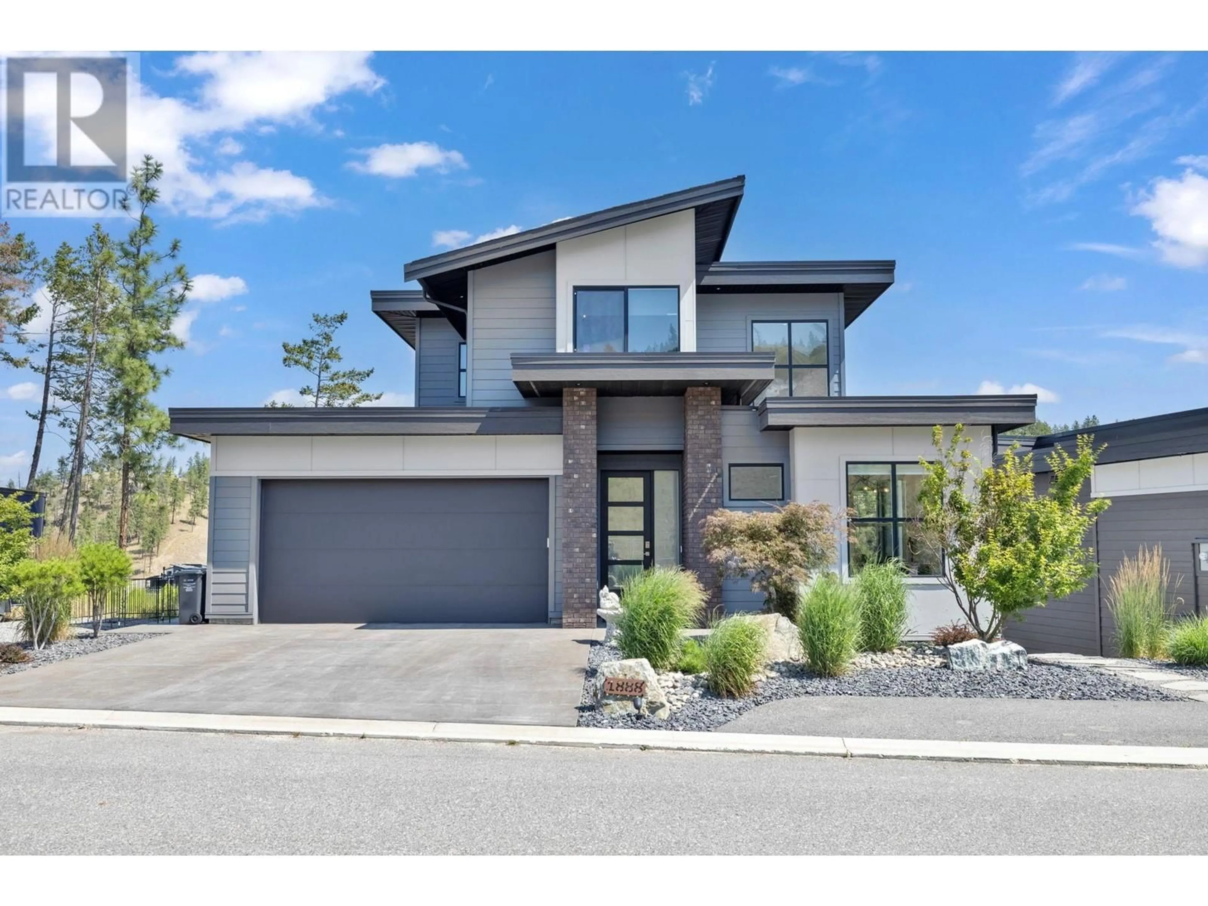 Home with brick exterior material, street for 1888 Northern Flicker Court, Kelowna British Columbia V1V0G3