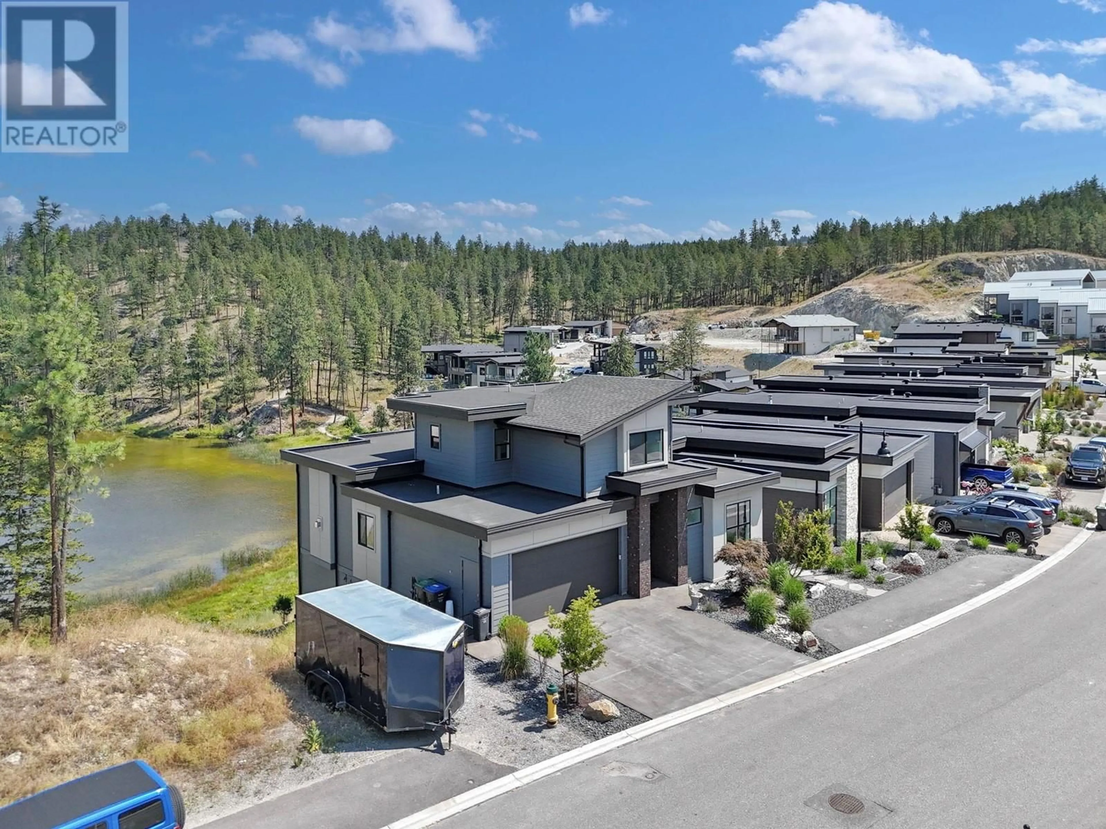 A pic from outside/outdoor area/front of a property/back of a property/a pic from drone, unknown for 1888 Northern Flicker Court, Kelowna British Columbia V1V0G3