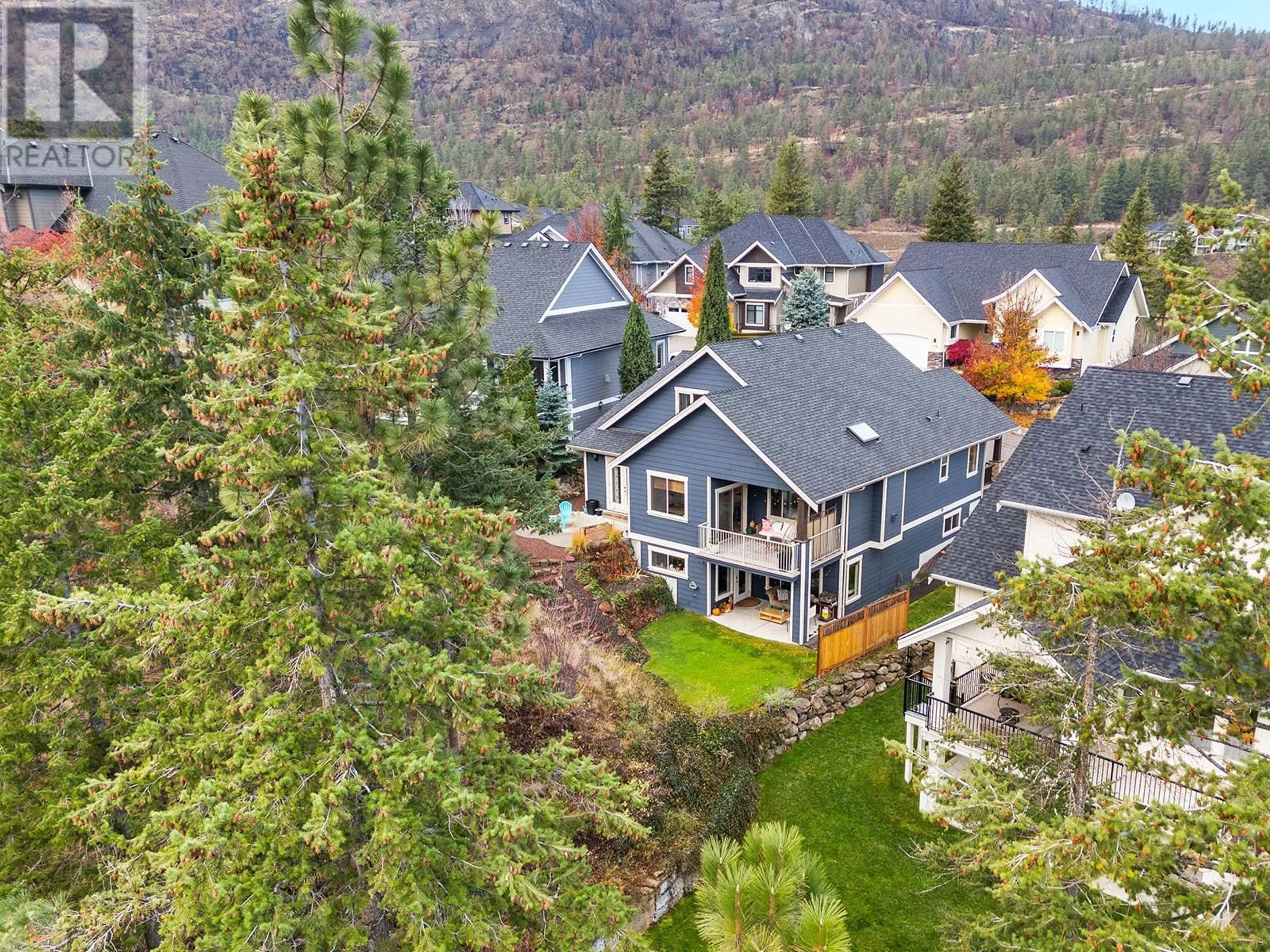 A pic from outside/outdoor area/front of a property/back of a property/a pic from drone, mountain view for 1101 Long Ridge Drive, Kelowna British Columbia V1V2W9