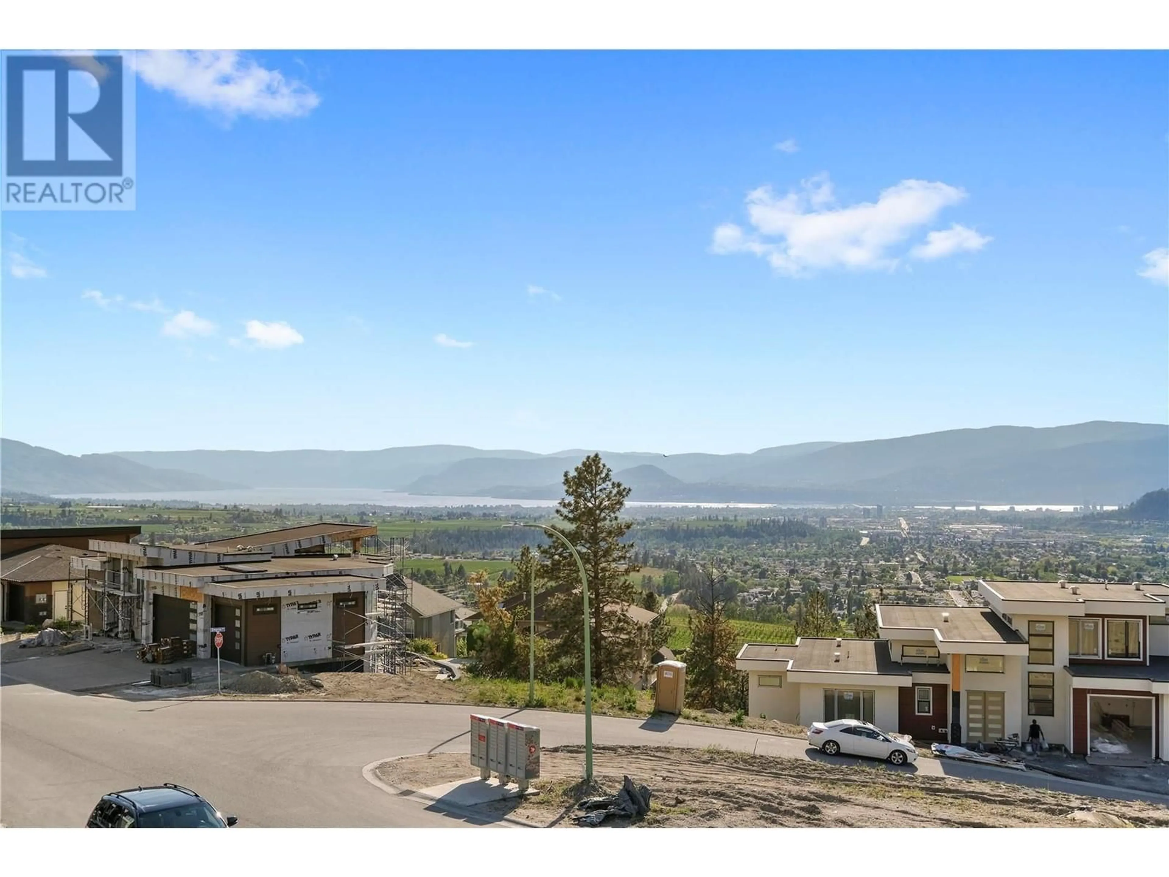 A pic from outside/outdoor area/front of a property/back of a property/a pic from drone, mountain view for 695 Deans Drive, Kelowna British Columbia V1P1A1