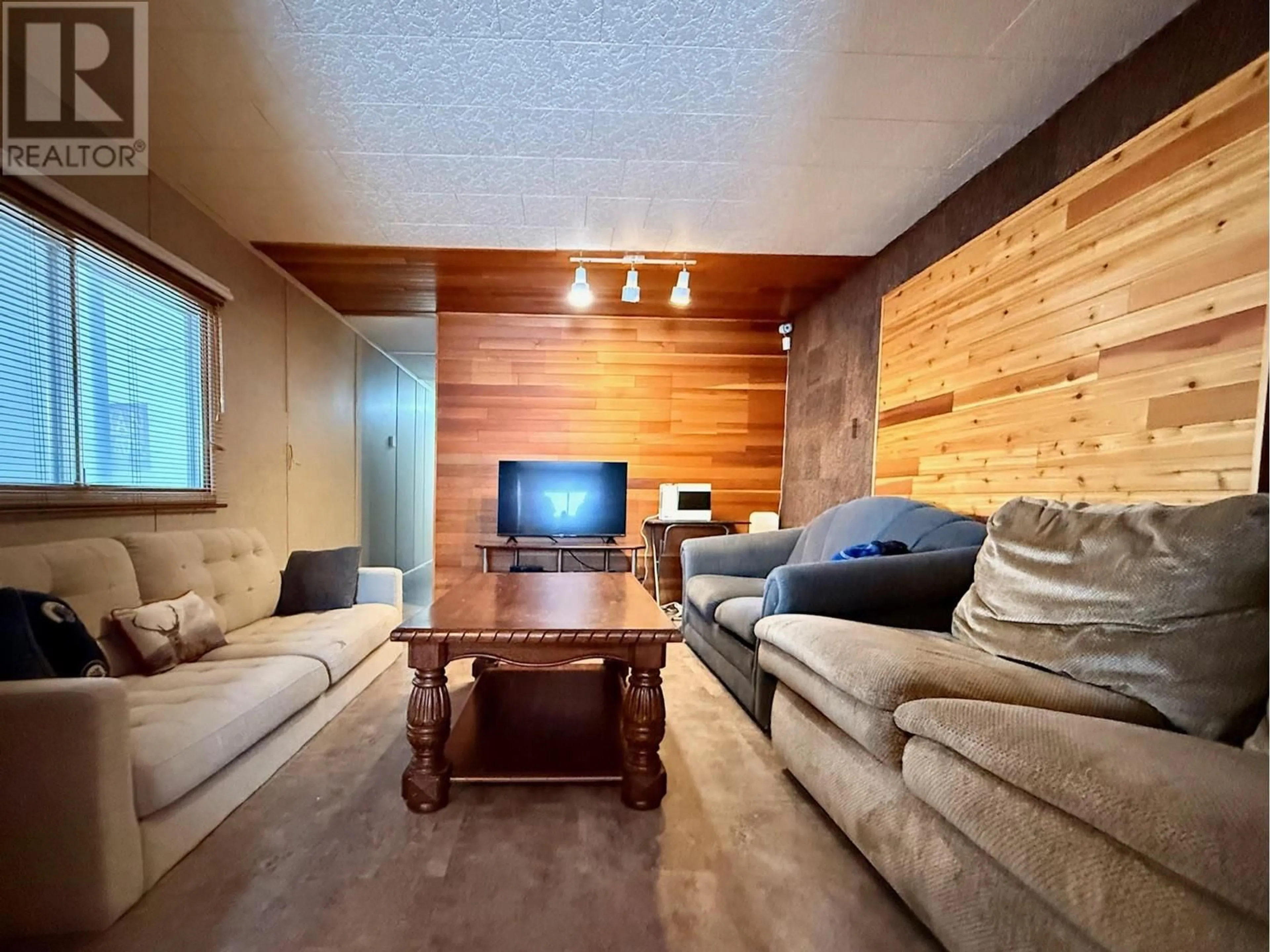 Living room with furniture, wood/laminate floor for 60 COKATO Road Unit# E10, Fernie British Columbia V0B1M4