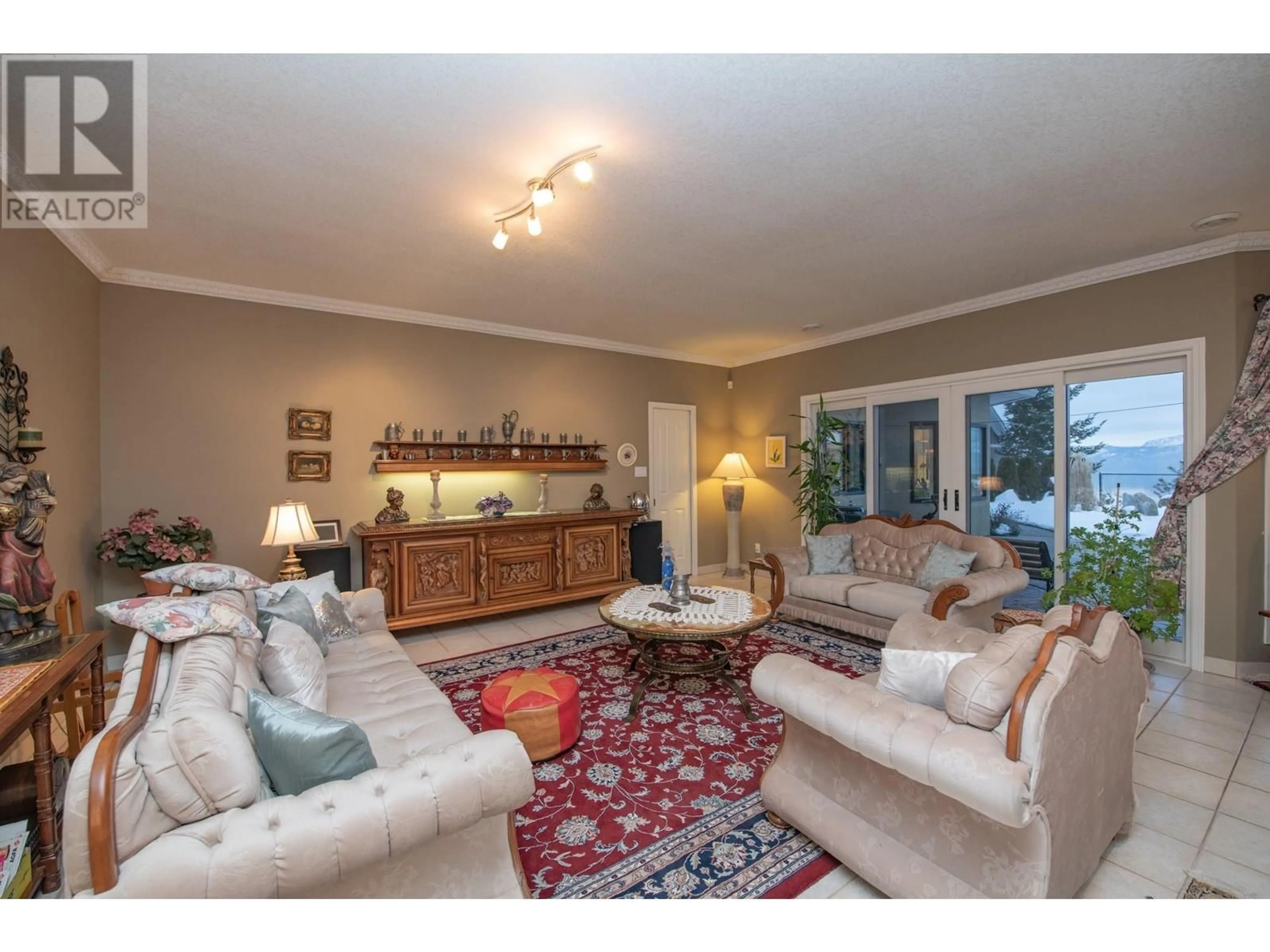 Living room with furniture, unknown for 6 9196 TRONSON ROAD, Vernon British Columbia V1H1E8