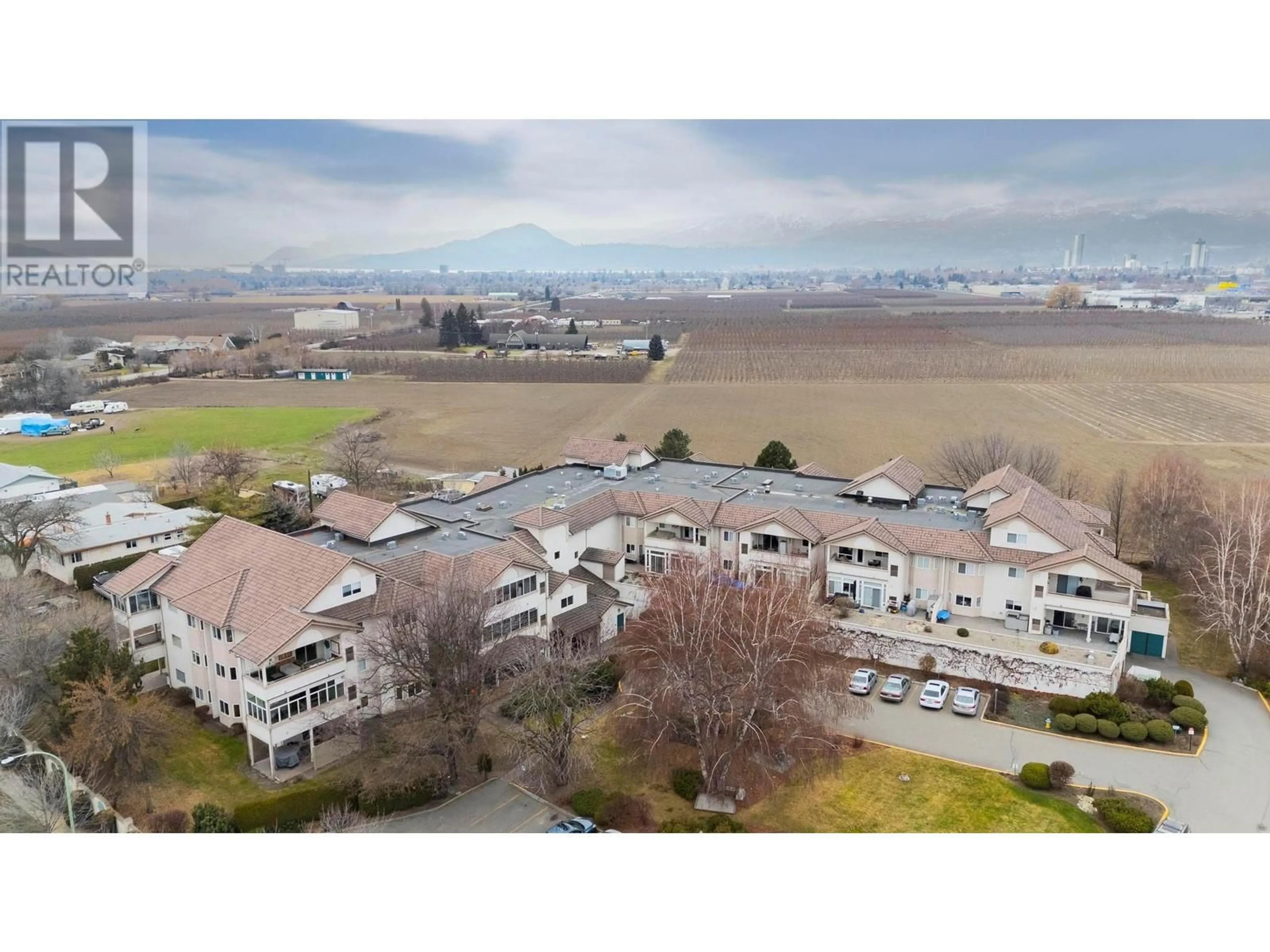 A pic from outside/outdoor area/front of a property/back of a property/a pic from drone, mountain view for 2300 Benvoulin Road Unit# 211, Kelowna British Columbia V1W2C6