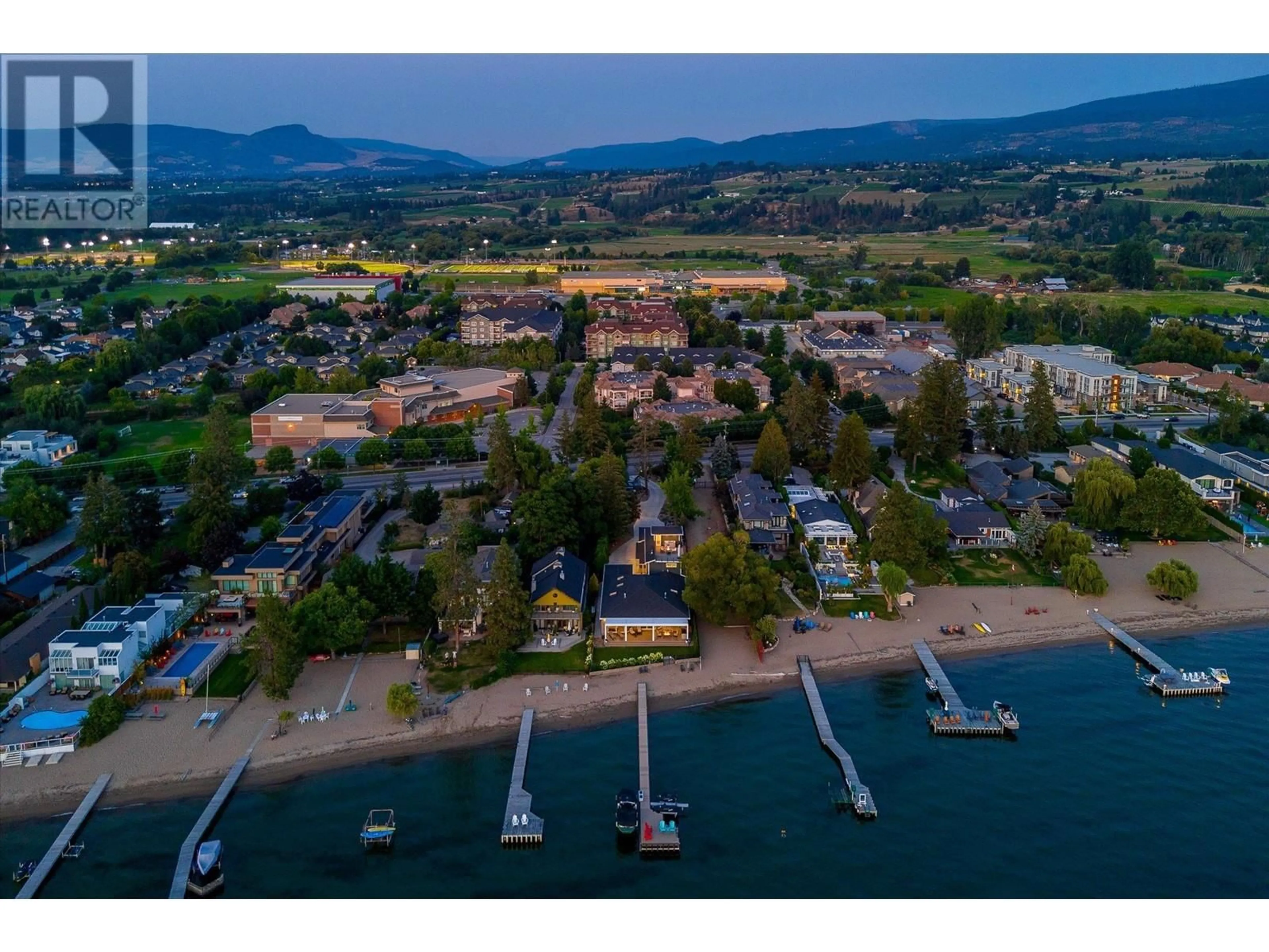A pic from outside/outdoor area/front of a property/back of a property/a pic from drone, water/lake/river/ocean view for 4096 LAKESHORE ROAD, Kelowna British Columbia V1W1V6