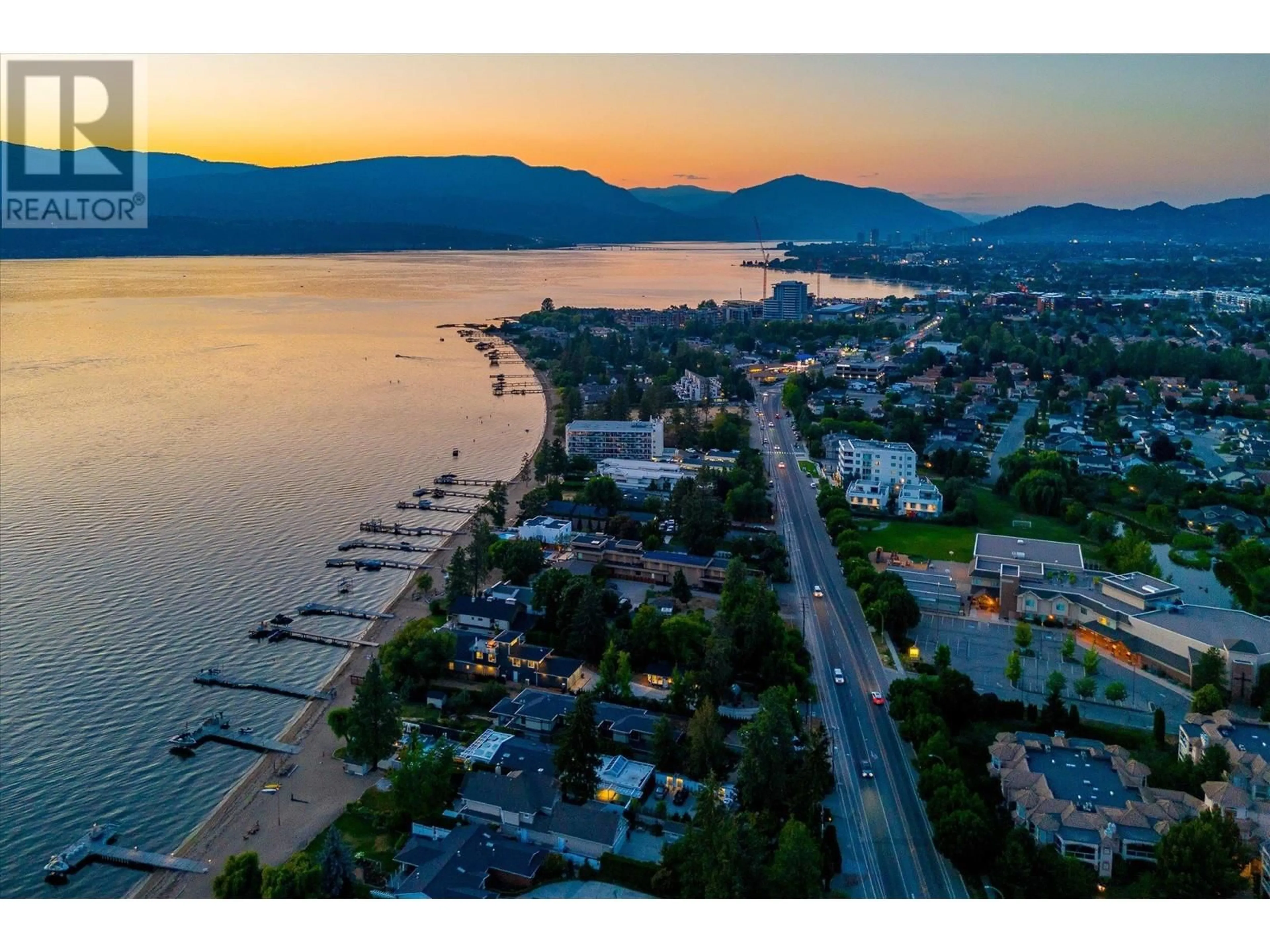 A pic from outside/outdoor area/front of a property/back of a property/a pic from drone, water/lake/river/ocean view for 4096 LAKESHORE ROAD, Kelowna British Columbia V1W1V6