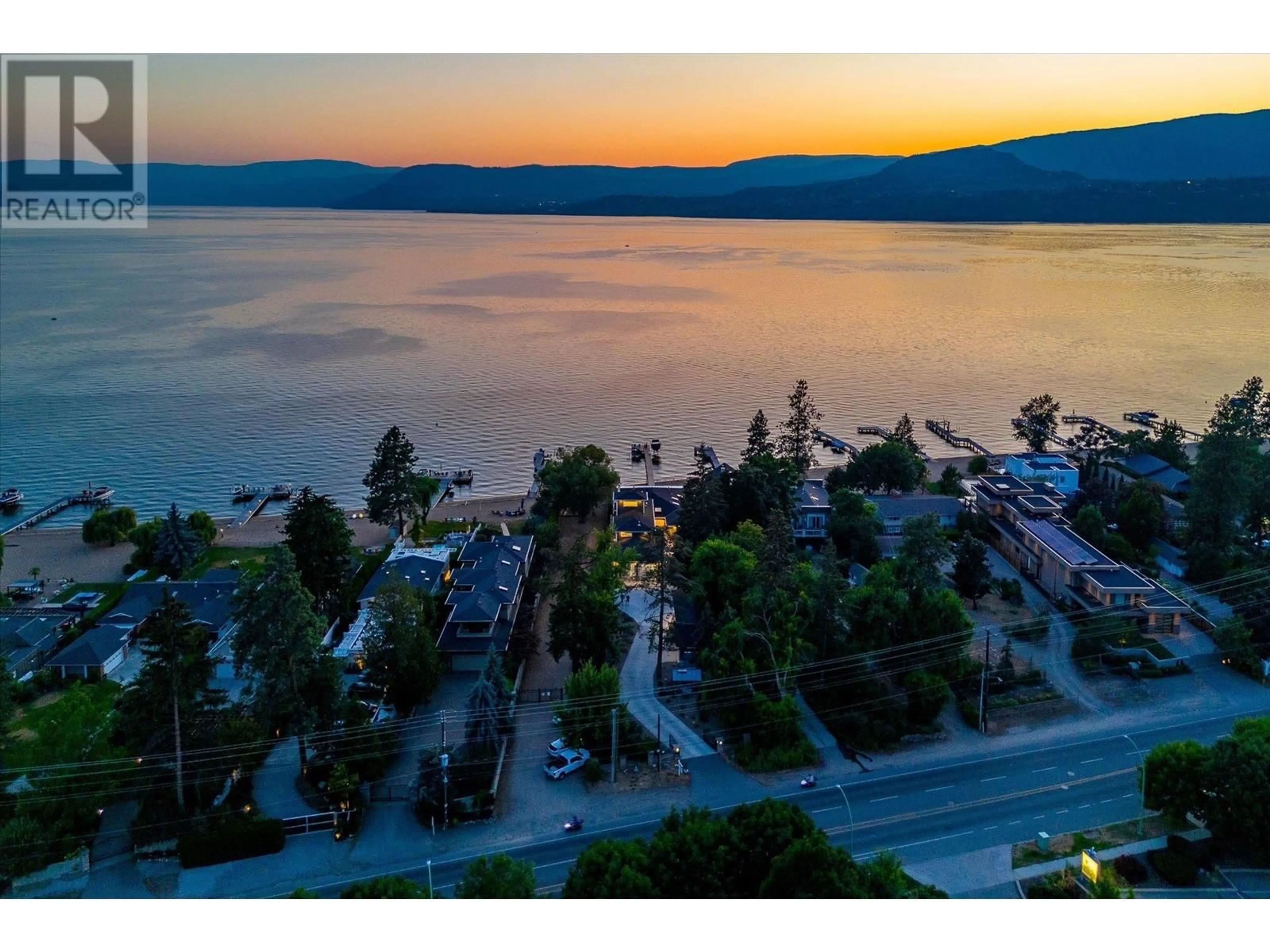 A pic from outside/outdoor area/front of a property/back of a property/a pic from drone, water/lake/river/ocean view for 4096 LAKESHORE ROAD, Kelowna British Columbia V1W1V6