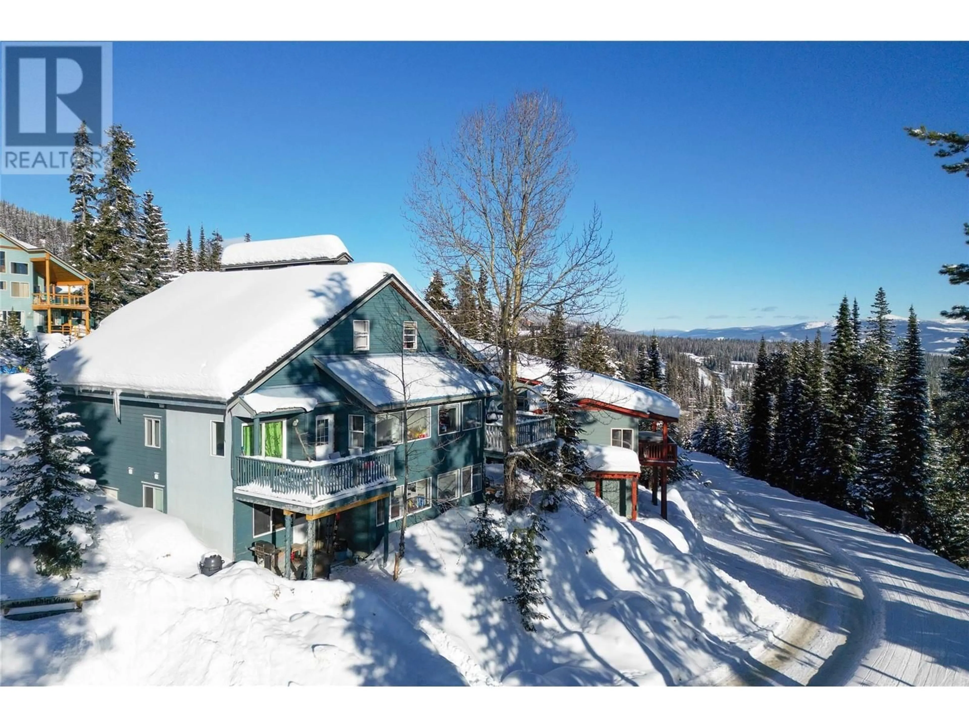 A pic from outside/outdoor area/front of a property/back of a property/a pic from drone, mountain view for D - 4817 SNOW PINES ROAD, Big White British Columbia V1P1P3