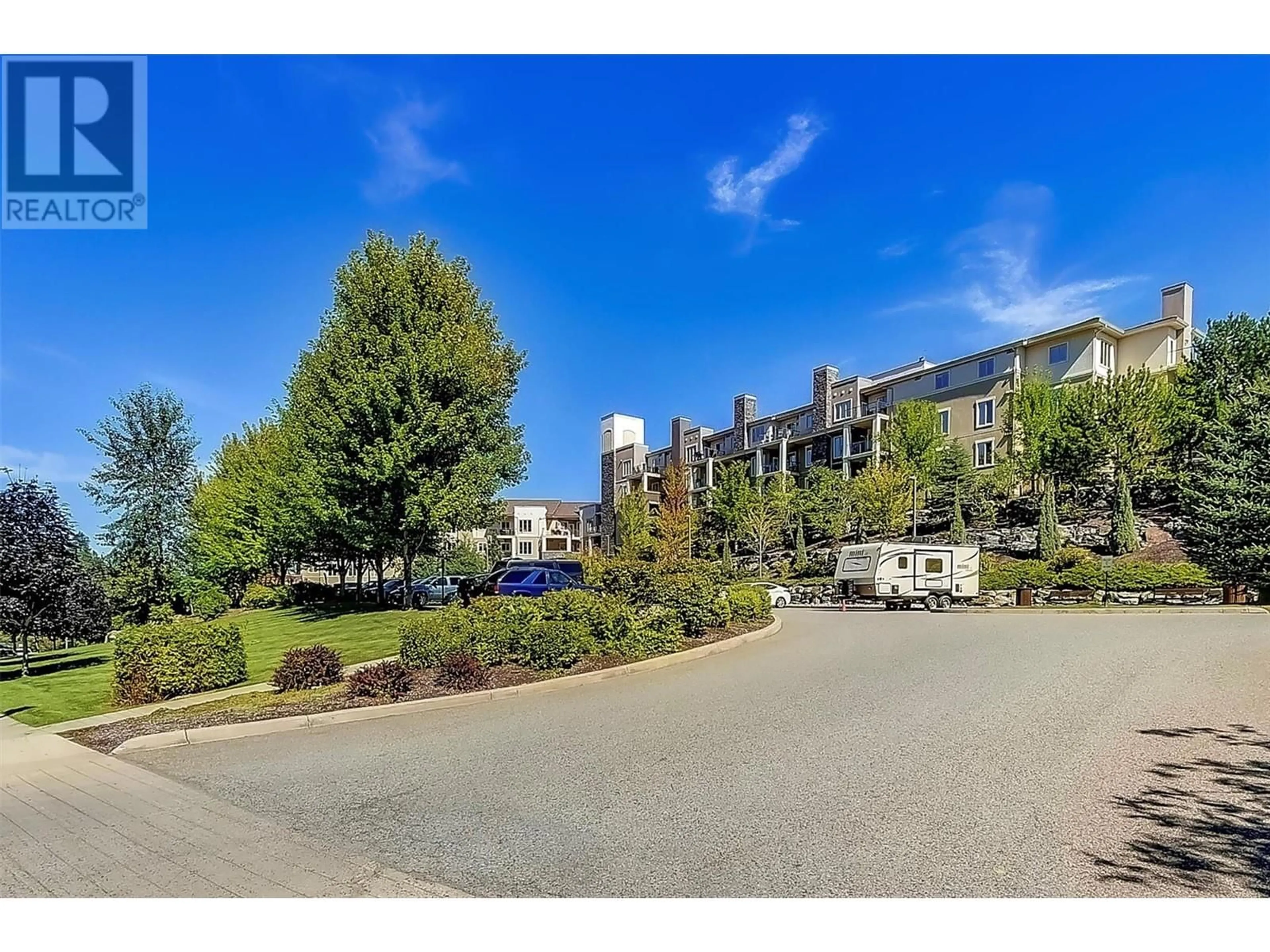 A pic from outside/outdoor area/front of a property/back of a property/a pic from drone, mountain view for 1875 Country Club Drive Unit# 1417 Lot# , Kelowna British Columbia V1V2W7