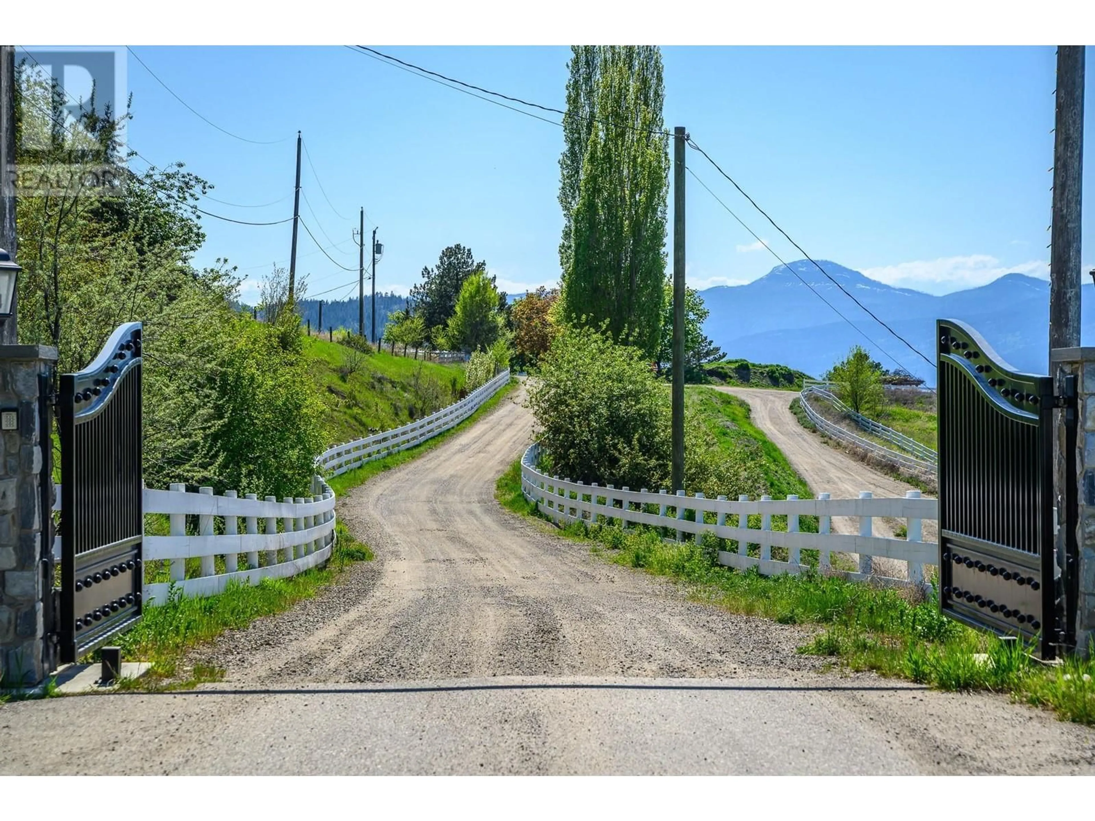 A pic from outside/outdoor area/front of a property/back of a property/a pic from drone, mountain view for 8399 BENCH ROW ROAD, Vernon British Columbia V1H1H3