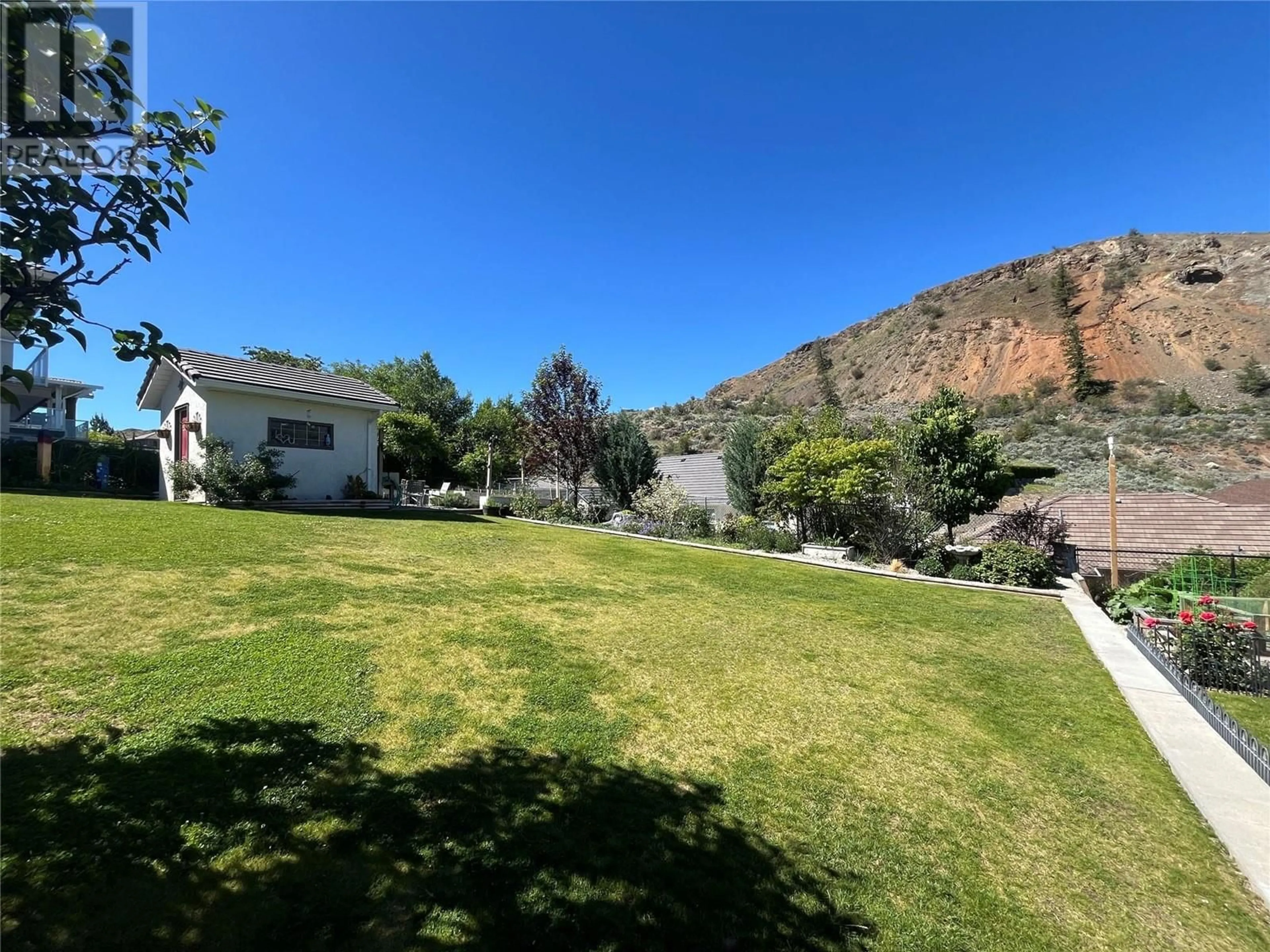 A pic from outside/outdoor area/front of a property/back of a property/a pic from drone, mountain view for 3808 SAWGRASS DRIVE, Osoyoos British Columbia V0H1V4