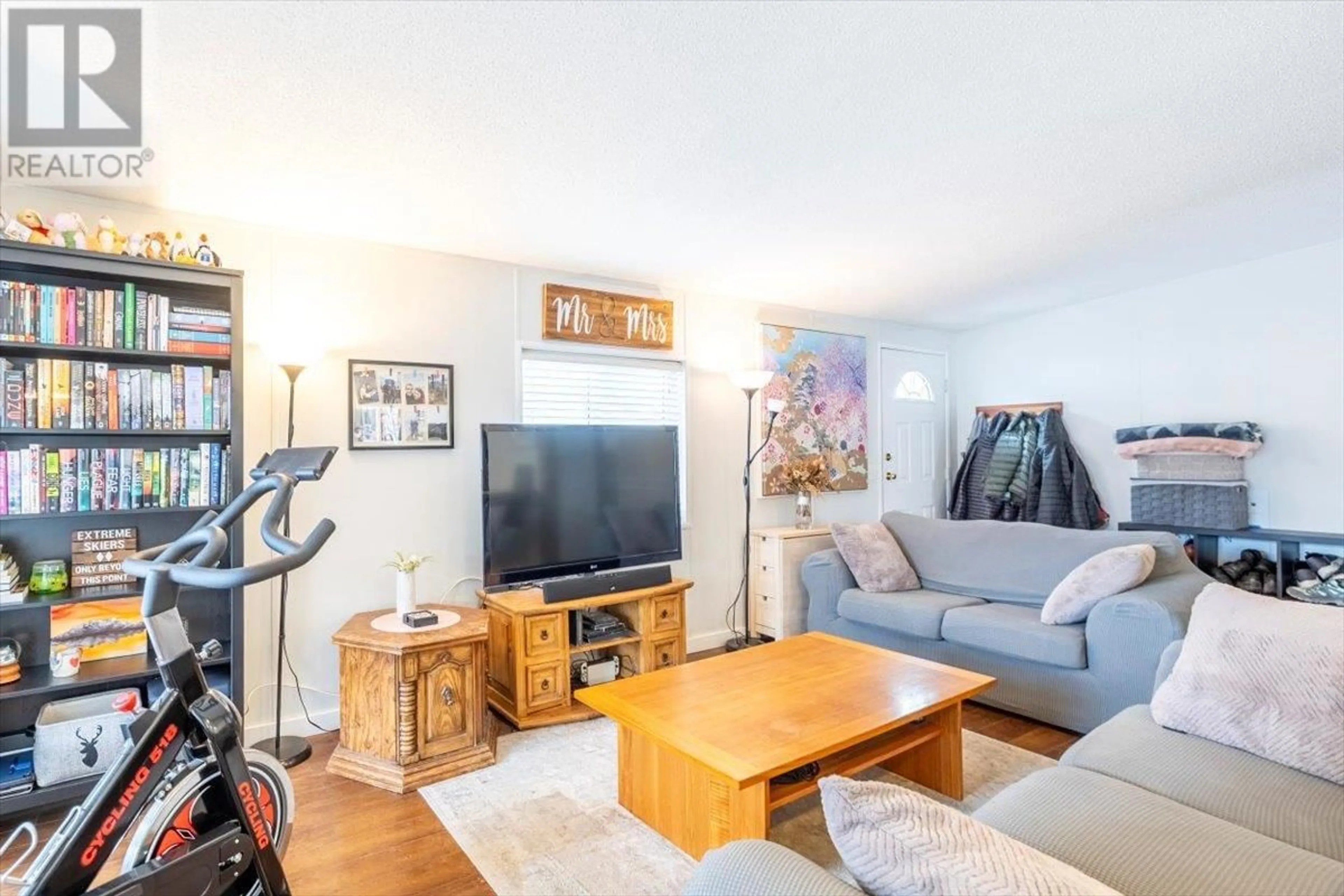 Living room with furniture, wood/laminate floor for 60 Cokato Road Unit# A2, Fernie British Columbia V0B1M4