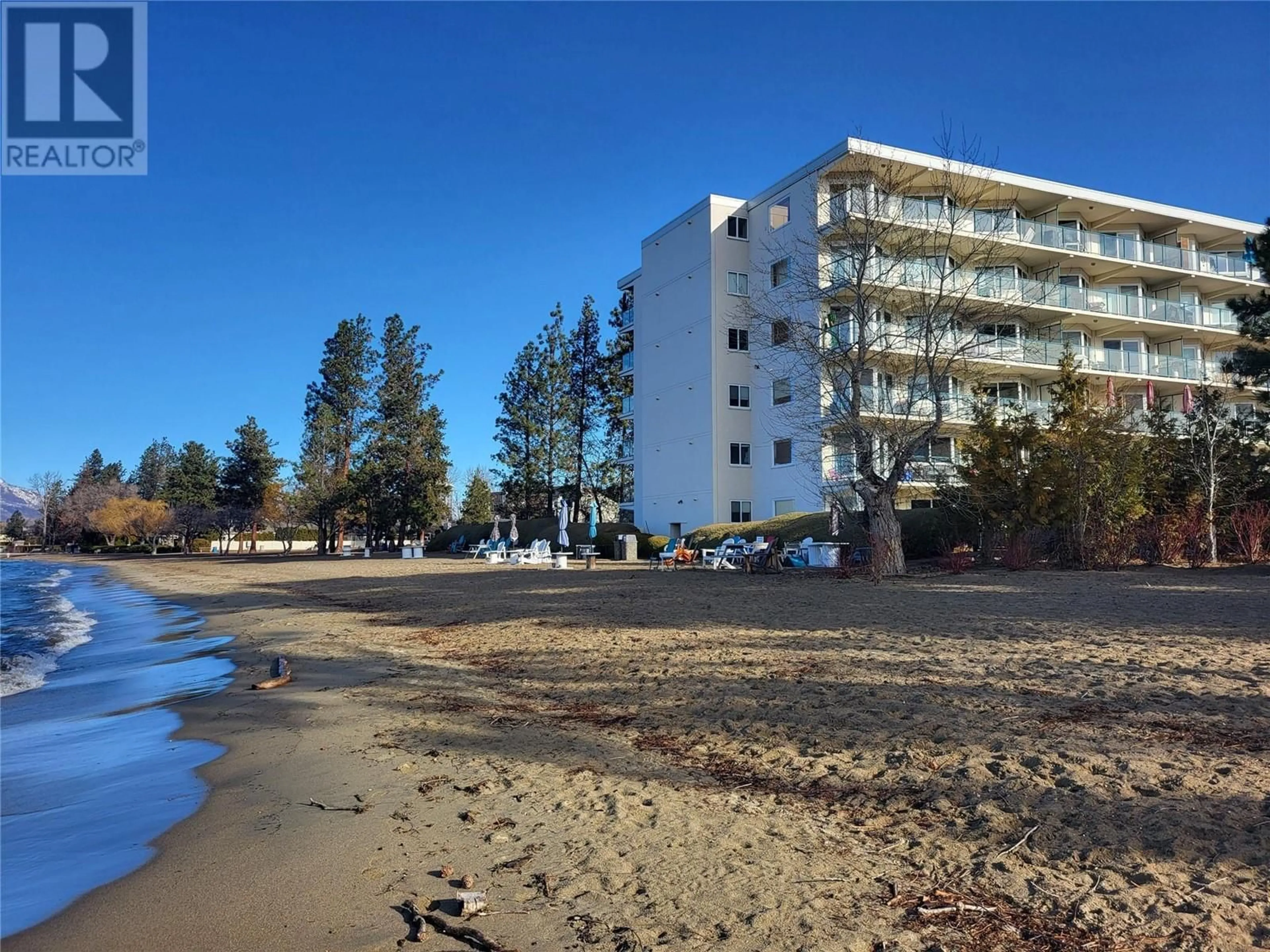 A pic from outside/outdoor area/front of a property/back of a property/a pic from drone, water/lake/river/ocean view for 205 - 4058 LAKESHORE ROAD, Kelowna British Columbia V1W1V6